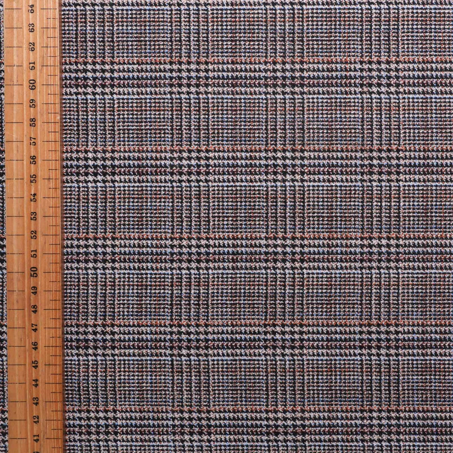 metre wool blend stretchy suiting dressmaking fabric with black and caramel check pattern on beige