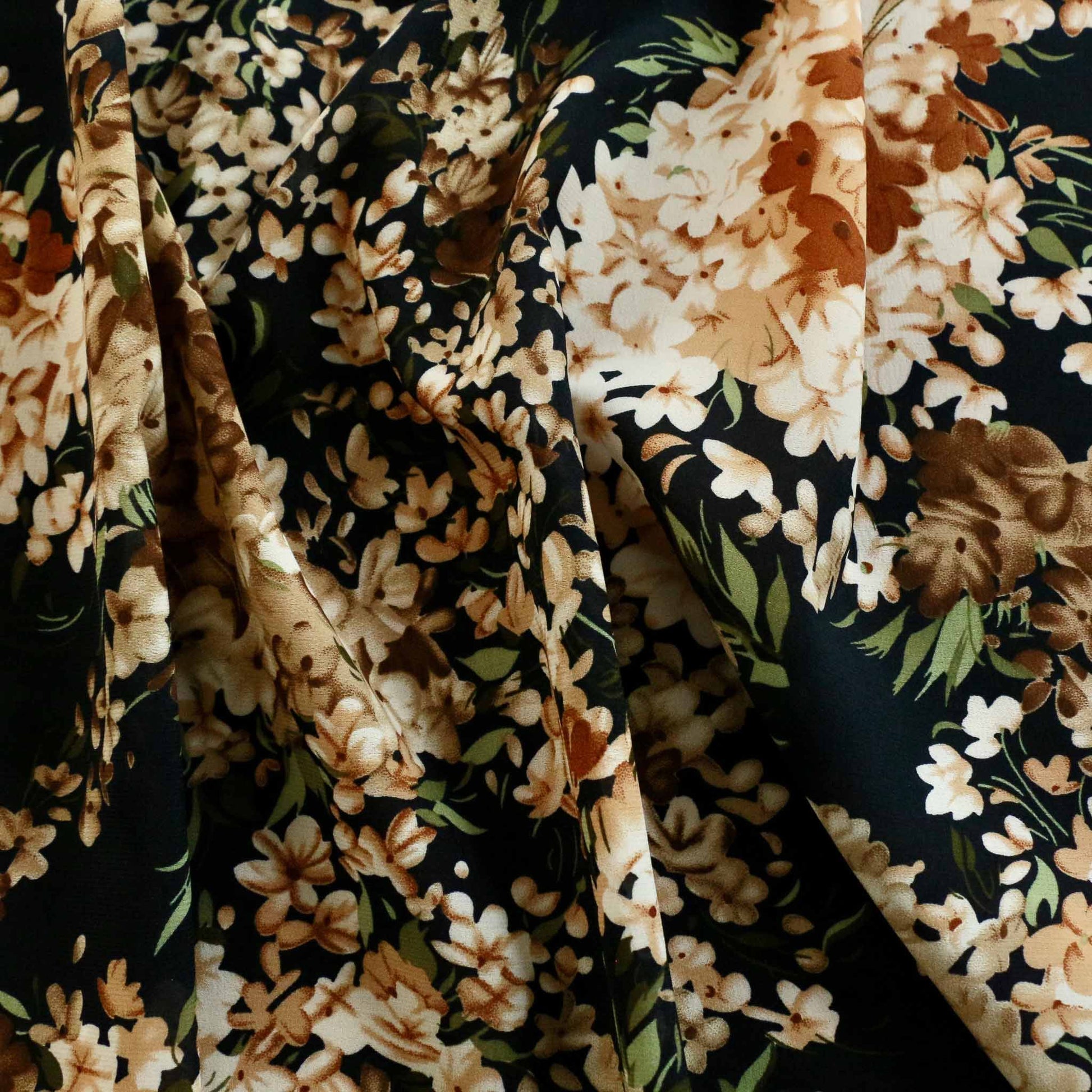 brown and beige floral print on navy chiffon stretchy dressmaking fabric