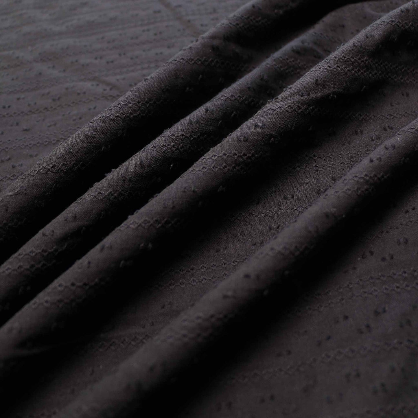 black cotton voile broad anglaise dressmaking fabric with dobby texture