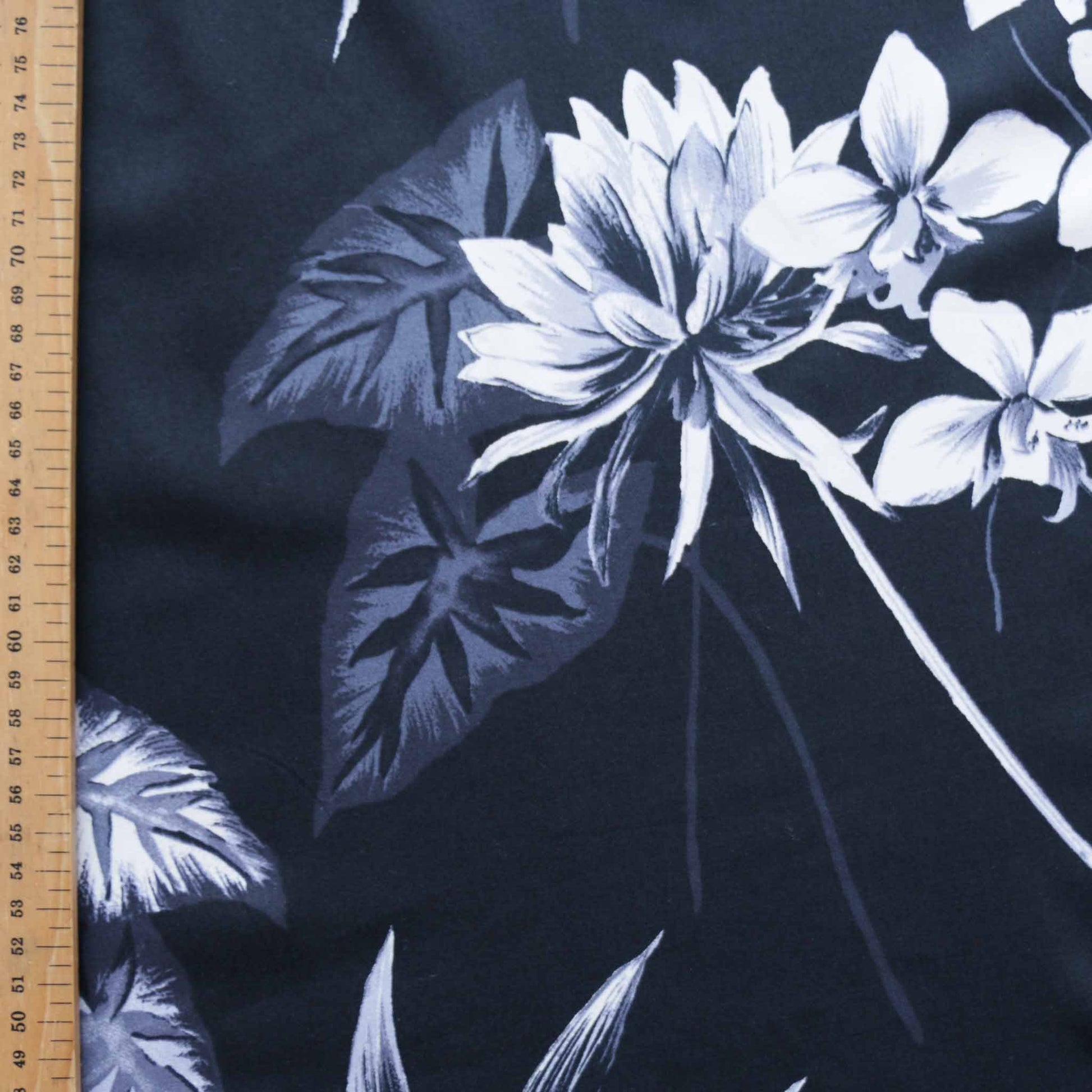 metre black cotton sateen dressmaking fabric with artist painted floral print