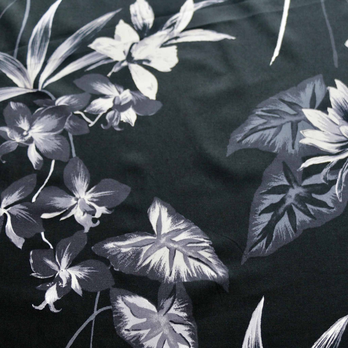 black cotton sateen stretchy dressmaking fabric with grey flowers