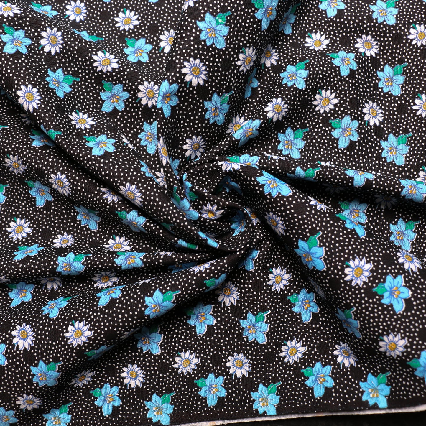 black vintage cotton poplin deadstock sustainable fabric with printed daisy pattern