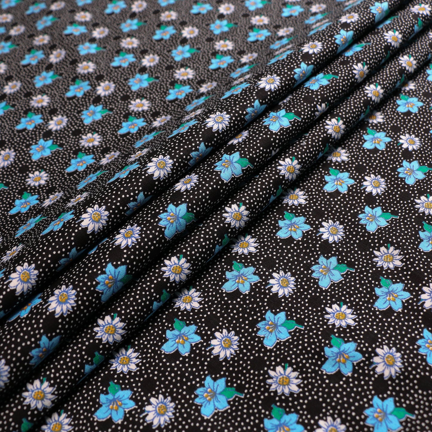 black vintage cotton dressmaking sustainable deadstock fabric with blue white floral print