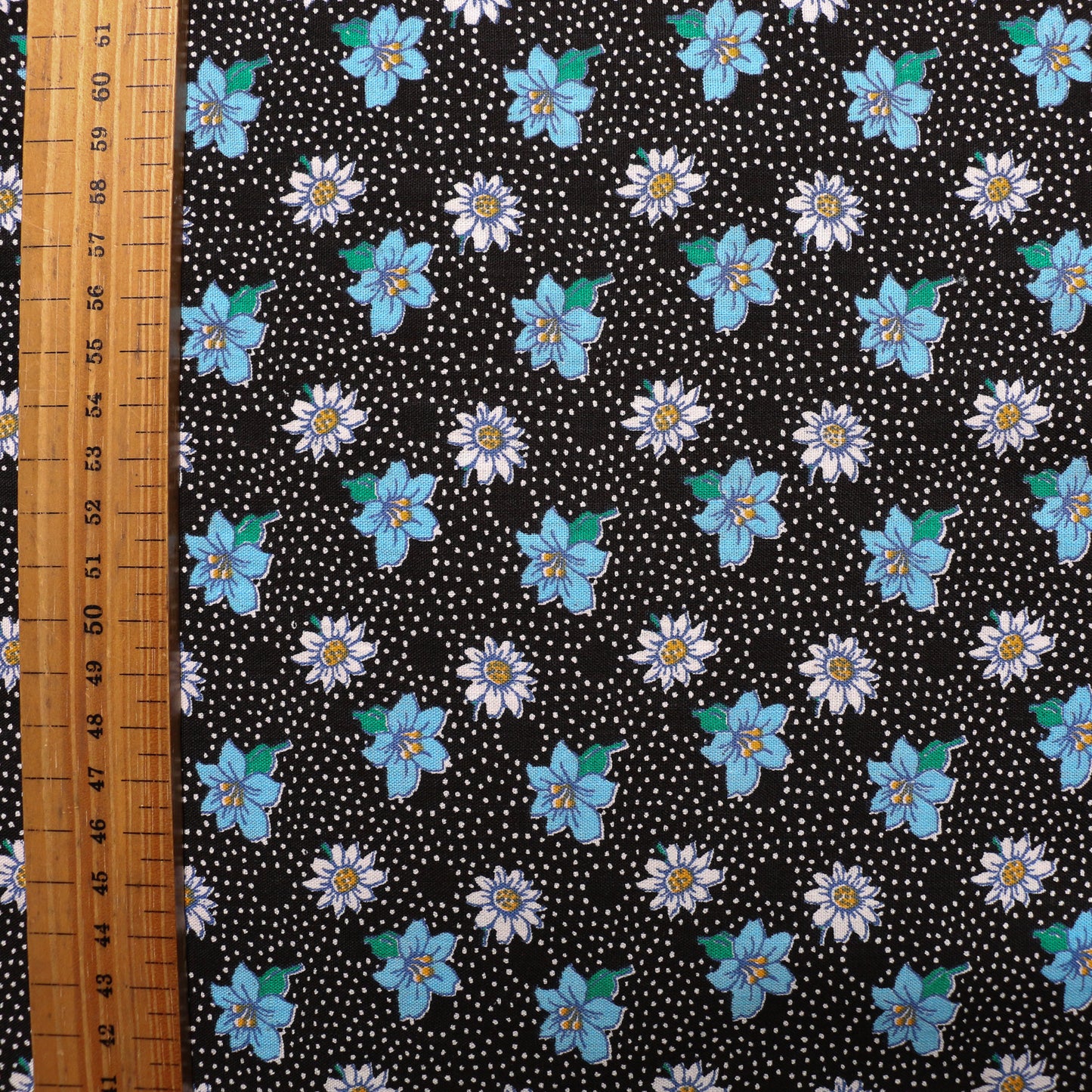 black sustainable vintage cotton dressmaking poplin fabric with blue white floral print