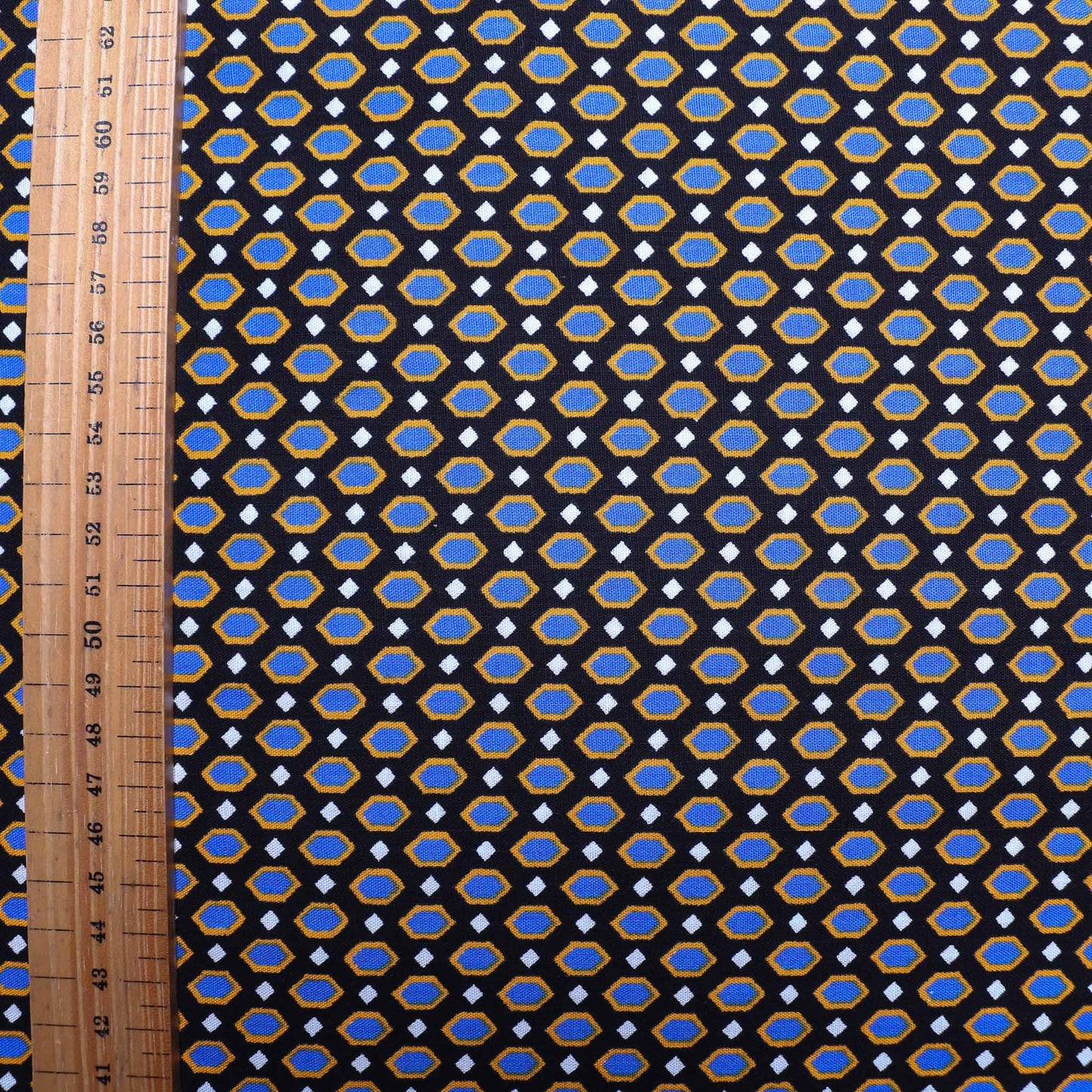 vintage sustainable cotton dressmaking fabric with retro geometric pattern