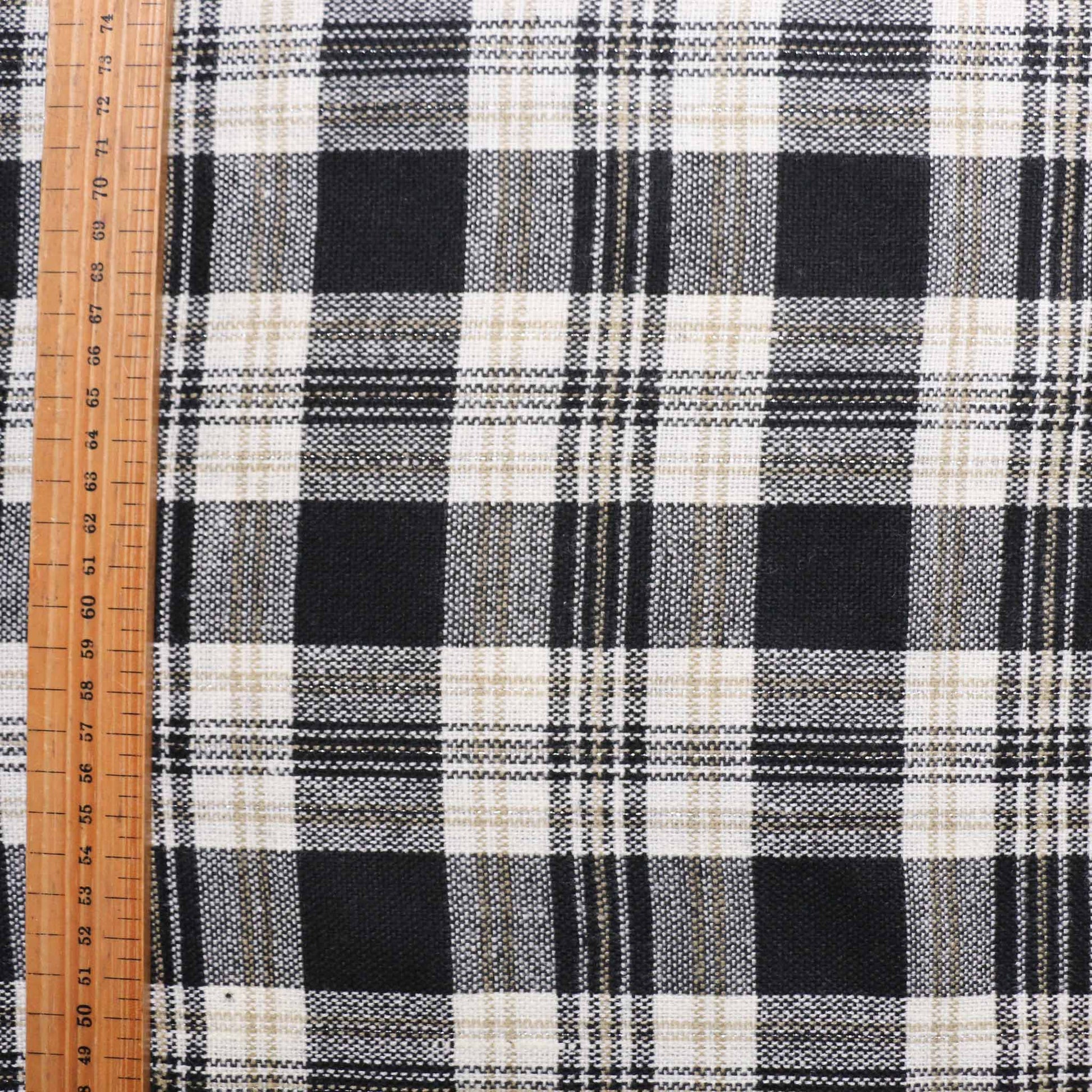 metre wool blend suiting dressmaking fabric with black and khaki check pattern on white