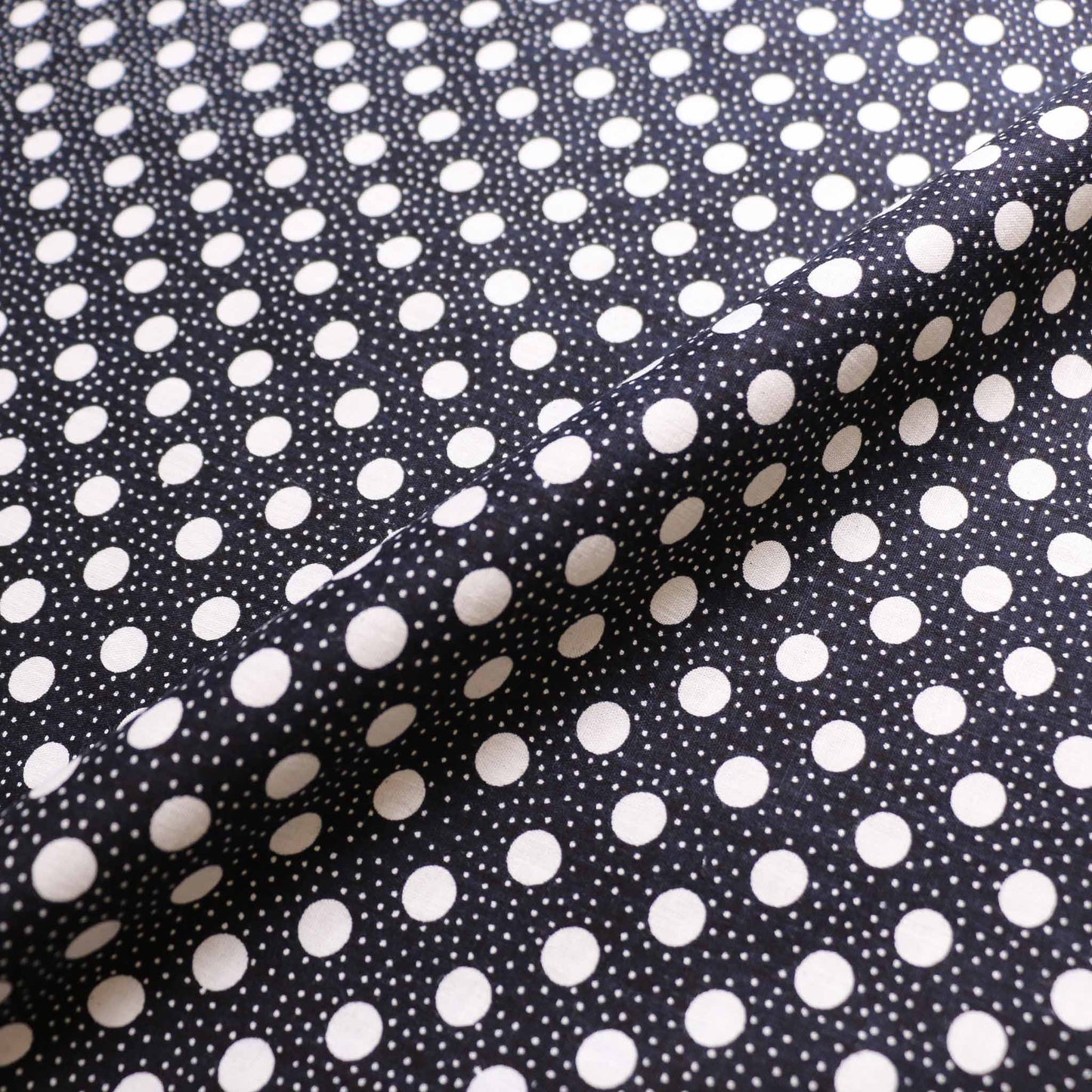 black vintage cotton dressmaking sustainable deadstock fabric with white dotty print