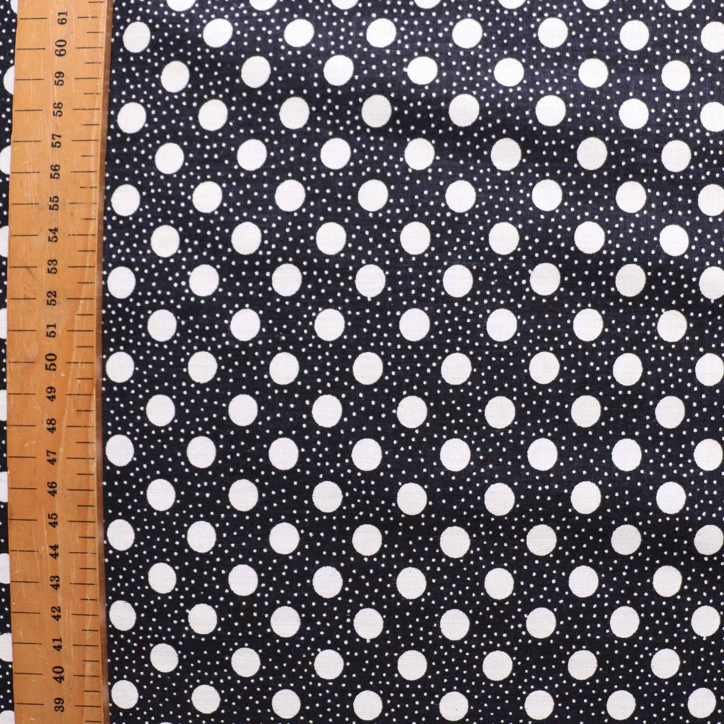 vintage sustainable cotton dressmaking fabric with retro polka dot pattern