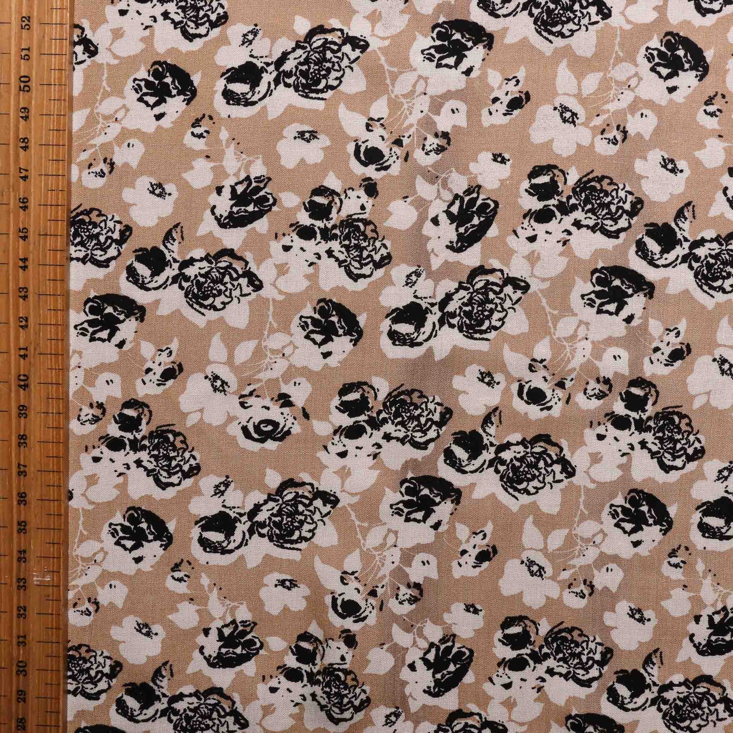 one metre black floral design on beige dress fabric