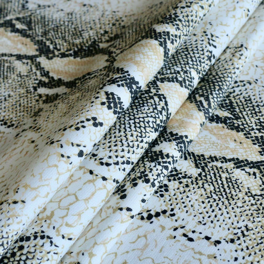 black and gold snake skin print ponte roma dressmaking fabric