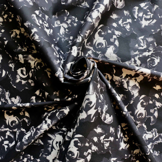 black and grey cotton sateen dressmaking fabric with floral print