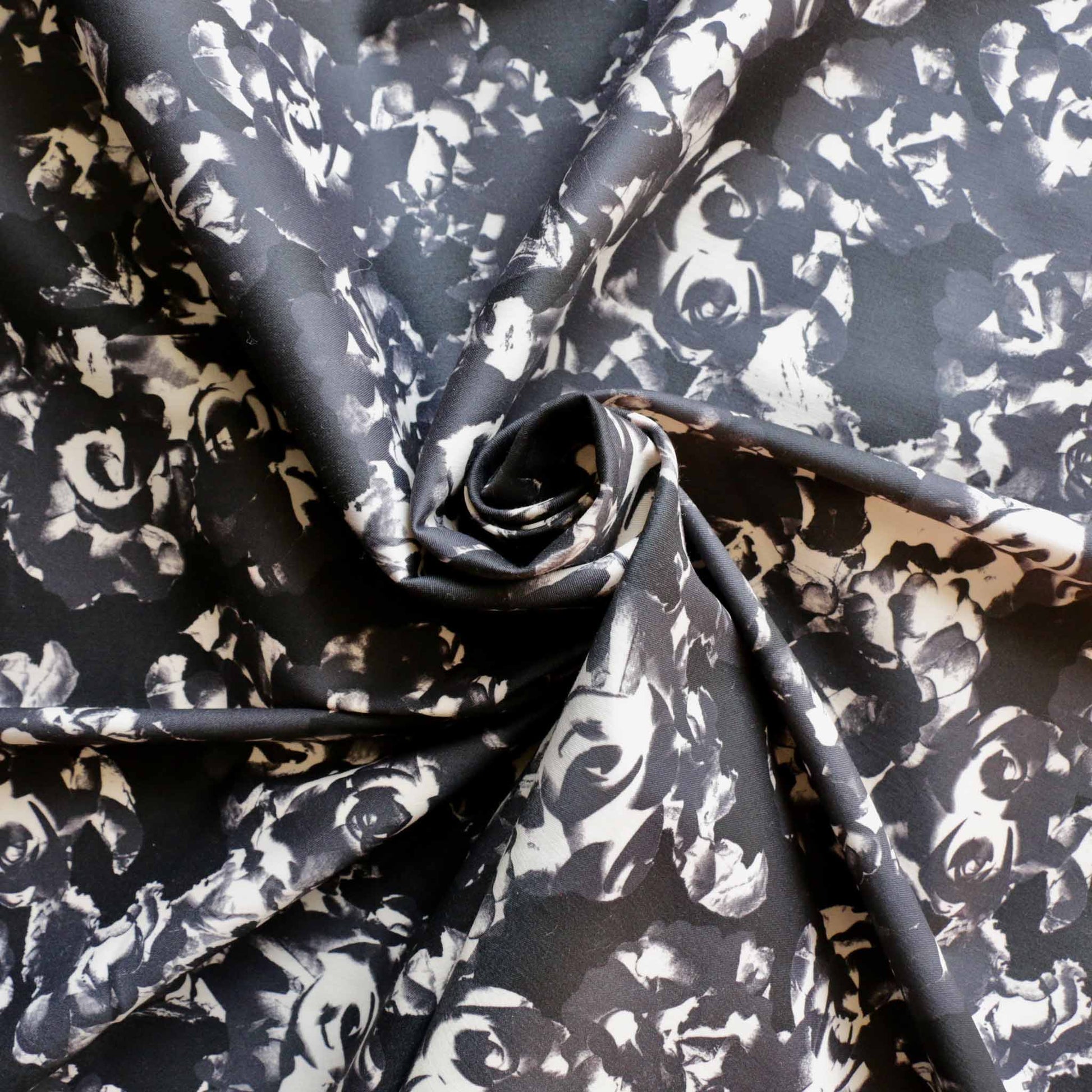 stretchy cotton sateen dressmaking fabric with floral print on black
