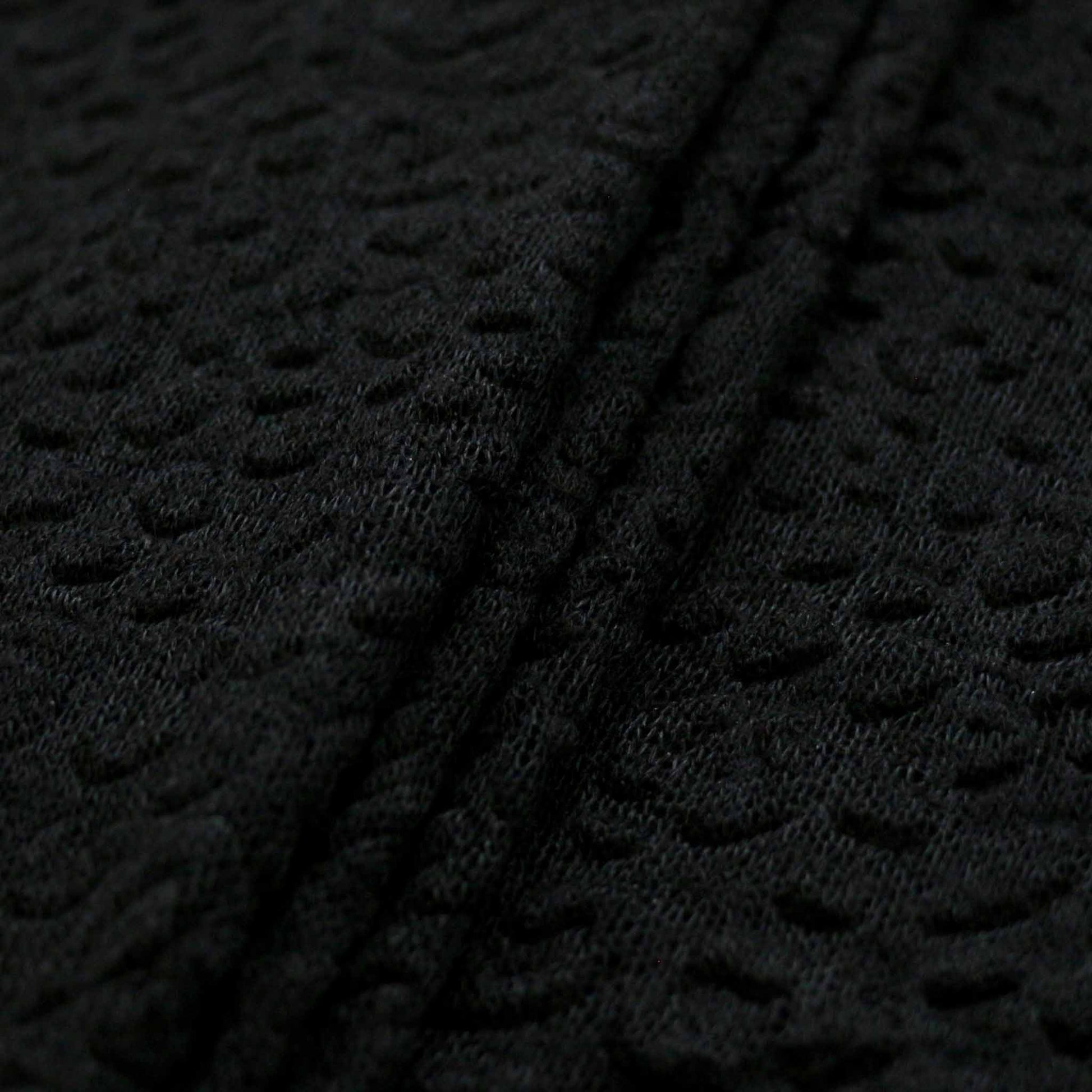 embossed decorative black jersey knit dressmaking fabric