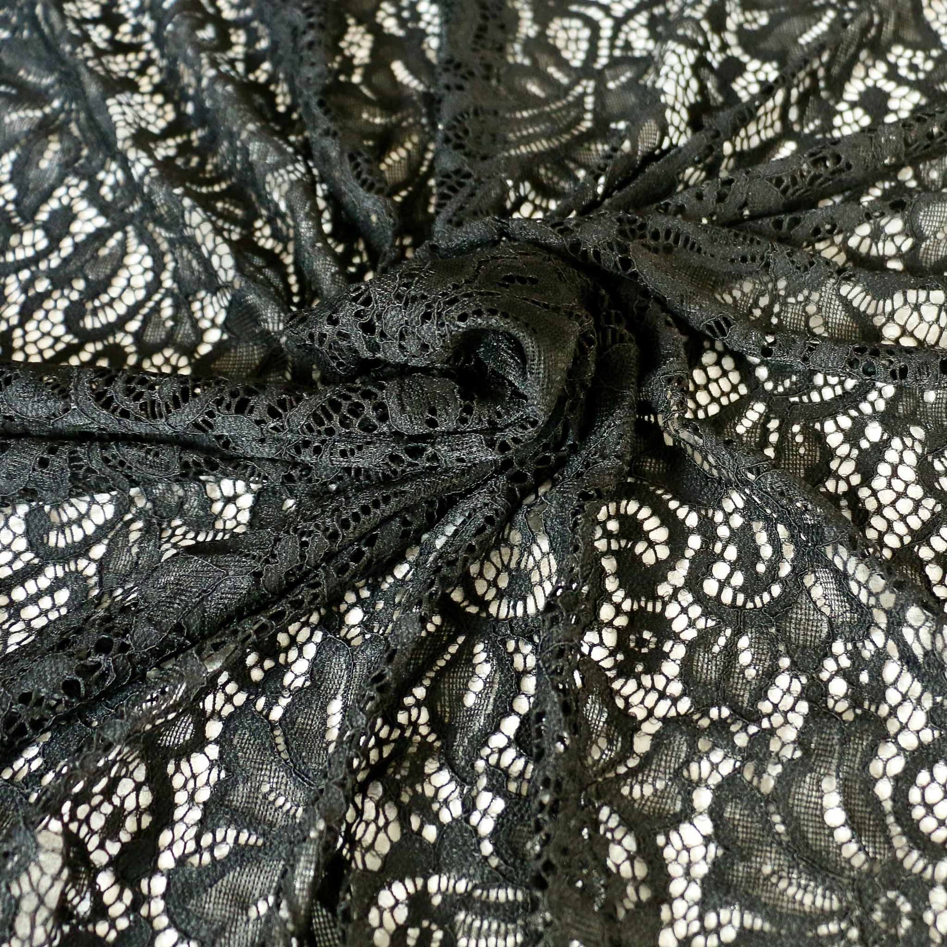 black lace dressmaking fabric with scalloped corded edge