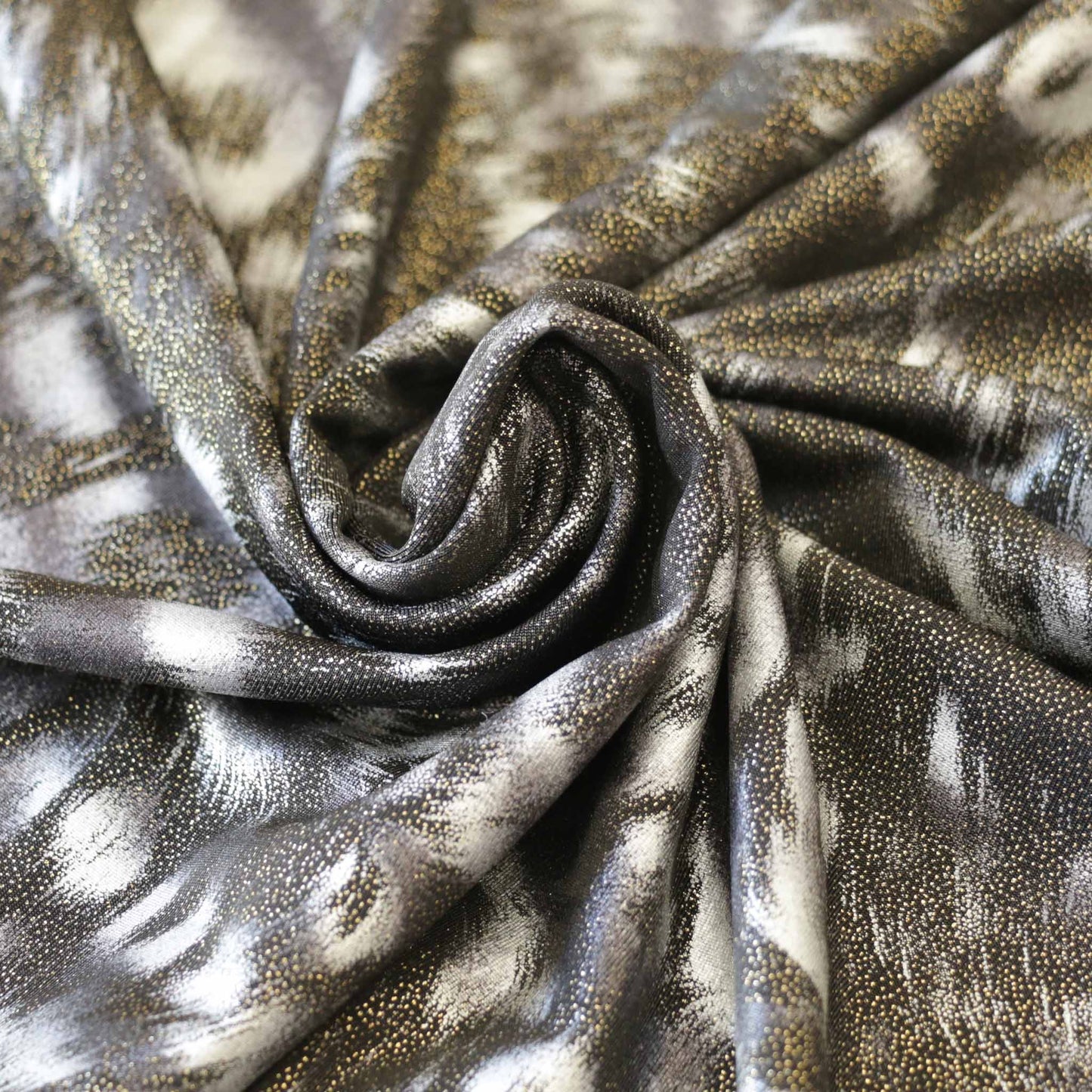 shiny gold and black lycra dressmaking fabric with animal print design
