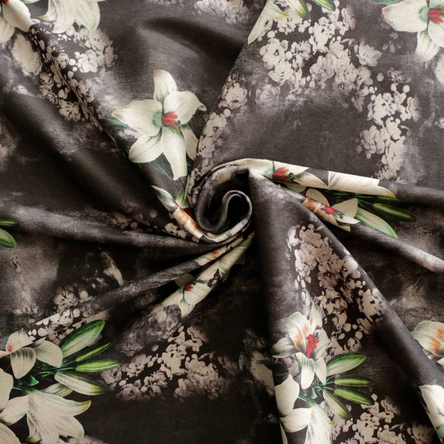 black moleskin suede dressmaking fabric with lily flower design