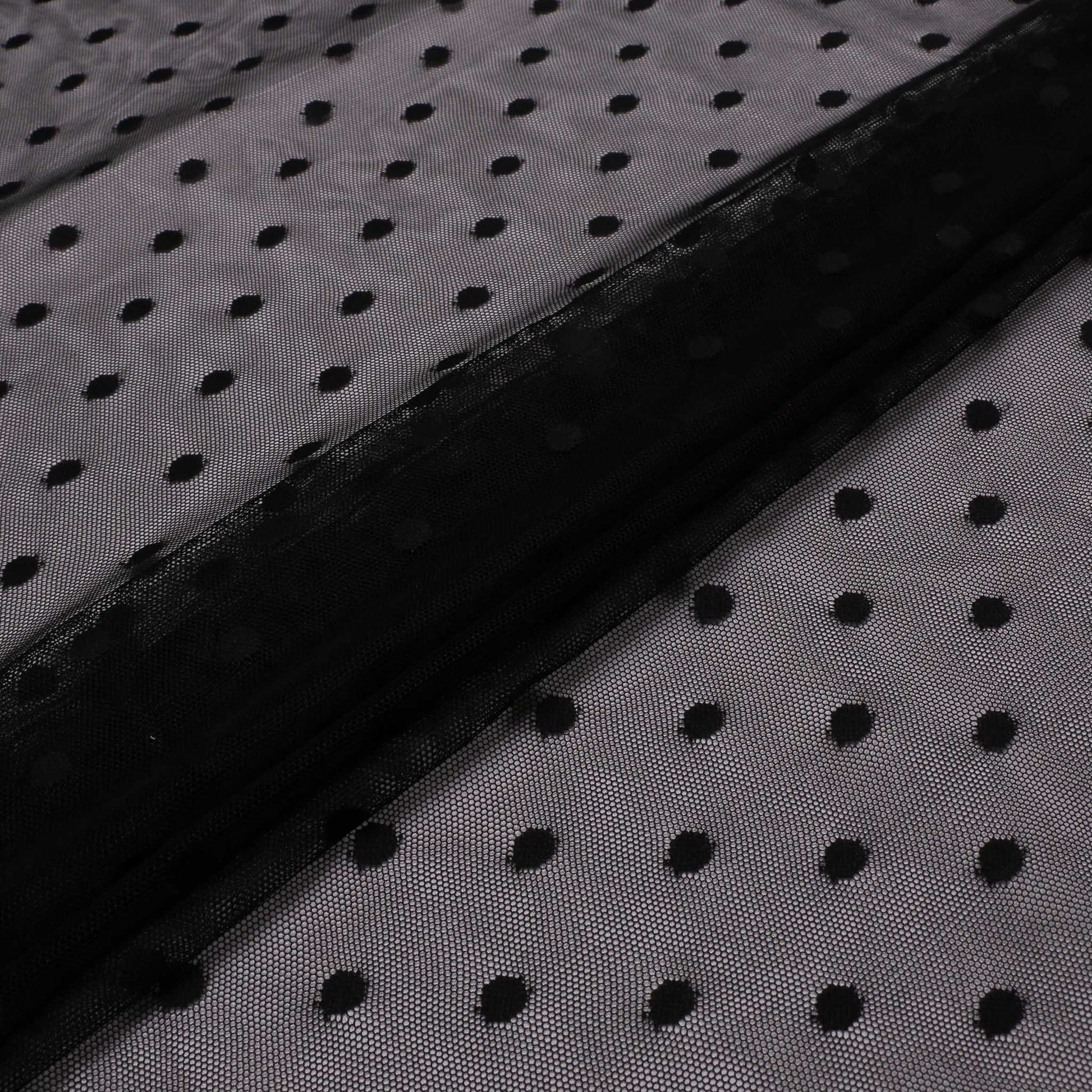 black folded netting fabric with polka dot pattern