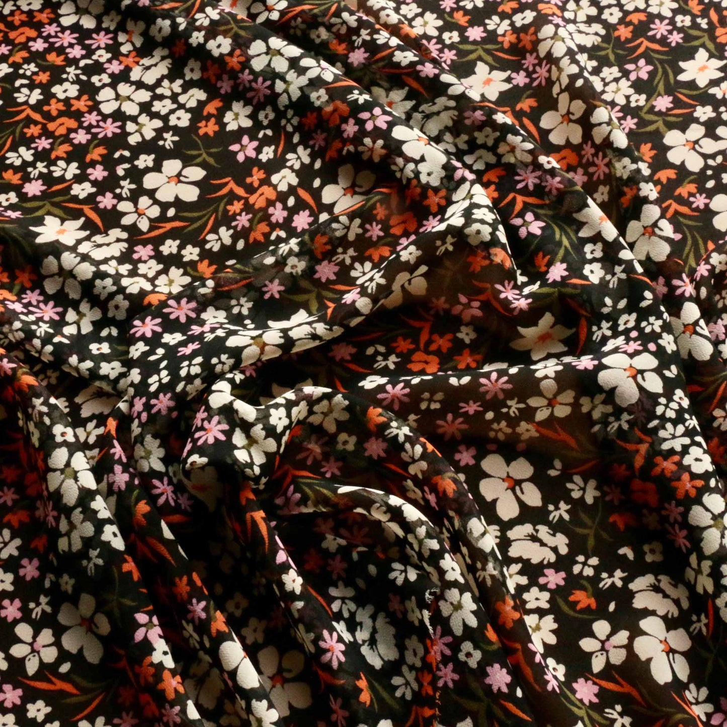 black and orange chiffon viscose dressmaking fabric with printed flower pattern
