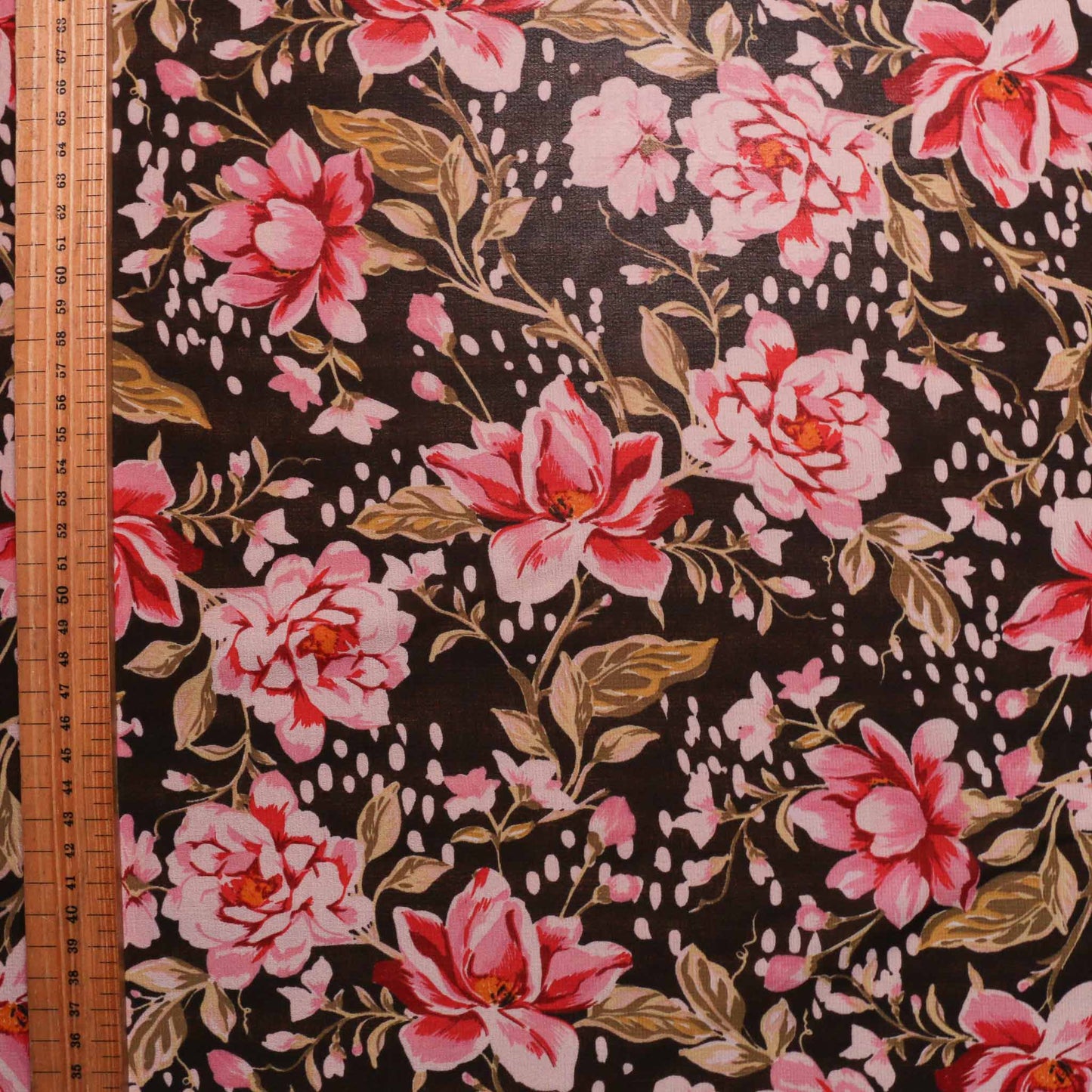 metre chiffon dressmaking fabric with black and pink floral design print