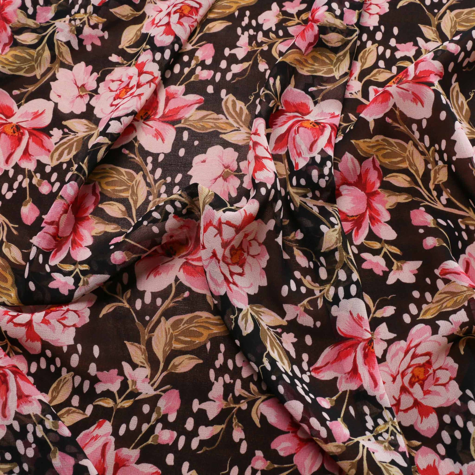 chiffon dressmaking fabric with pink floral flower design on black
