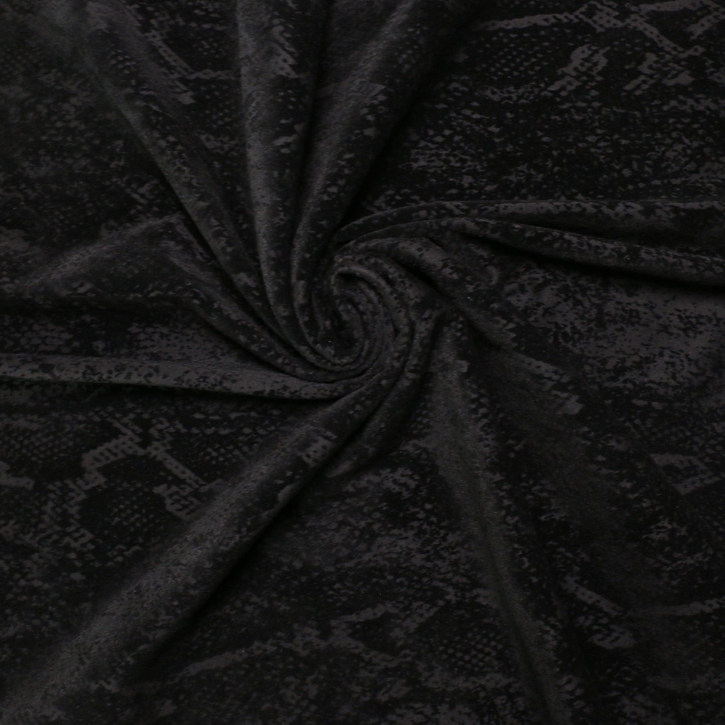black dressmaking jersey knit fabric with snake skin print