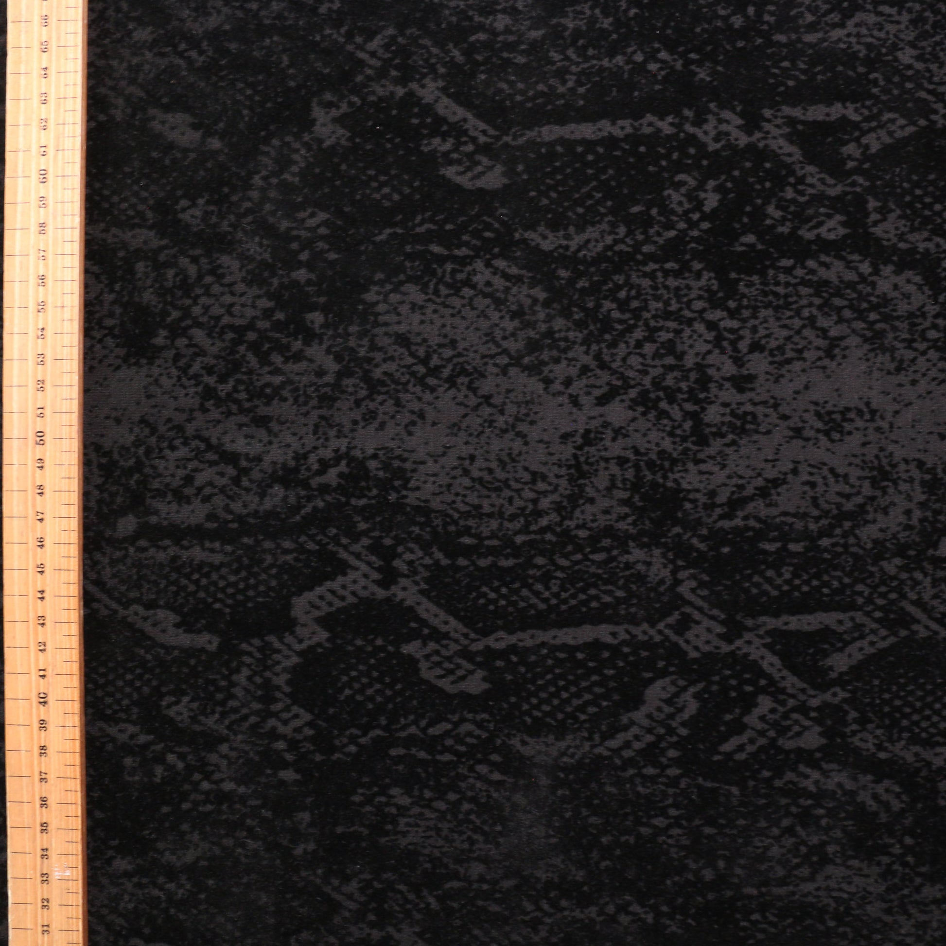 one metre black ponte roma fabric with snake skin animal print