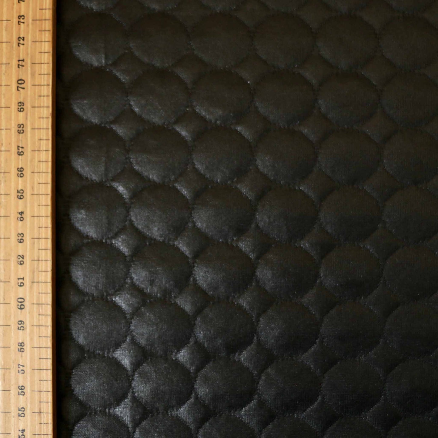 metre jersey quilting shiny dressmaking fabric with circle design in black