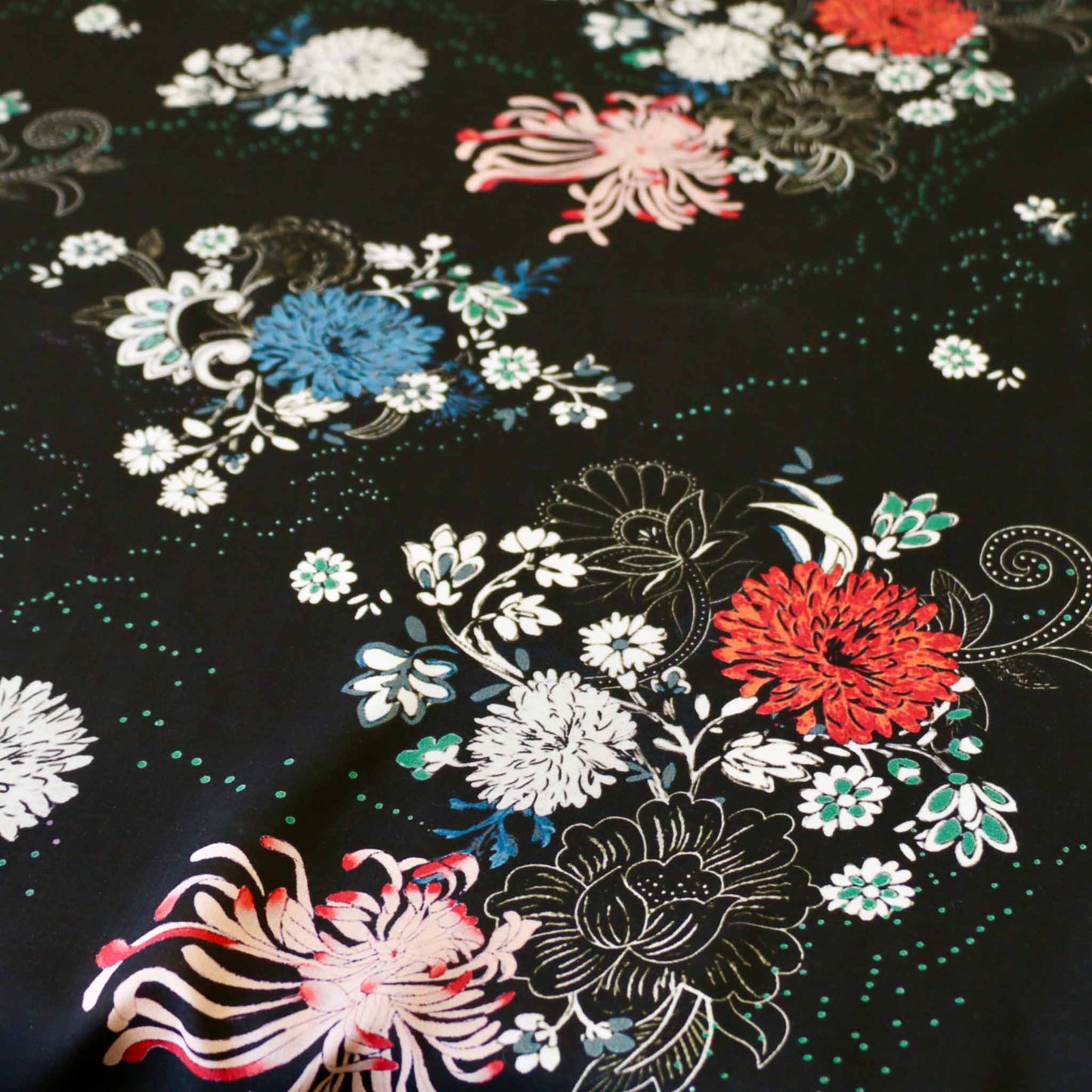 black viscose challis rayon dressmaking fabric with colourful floral print design