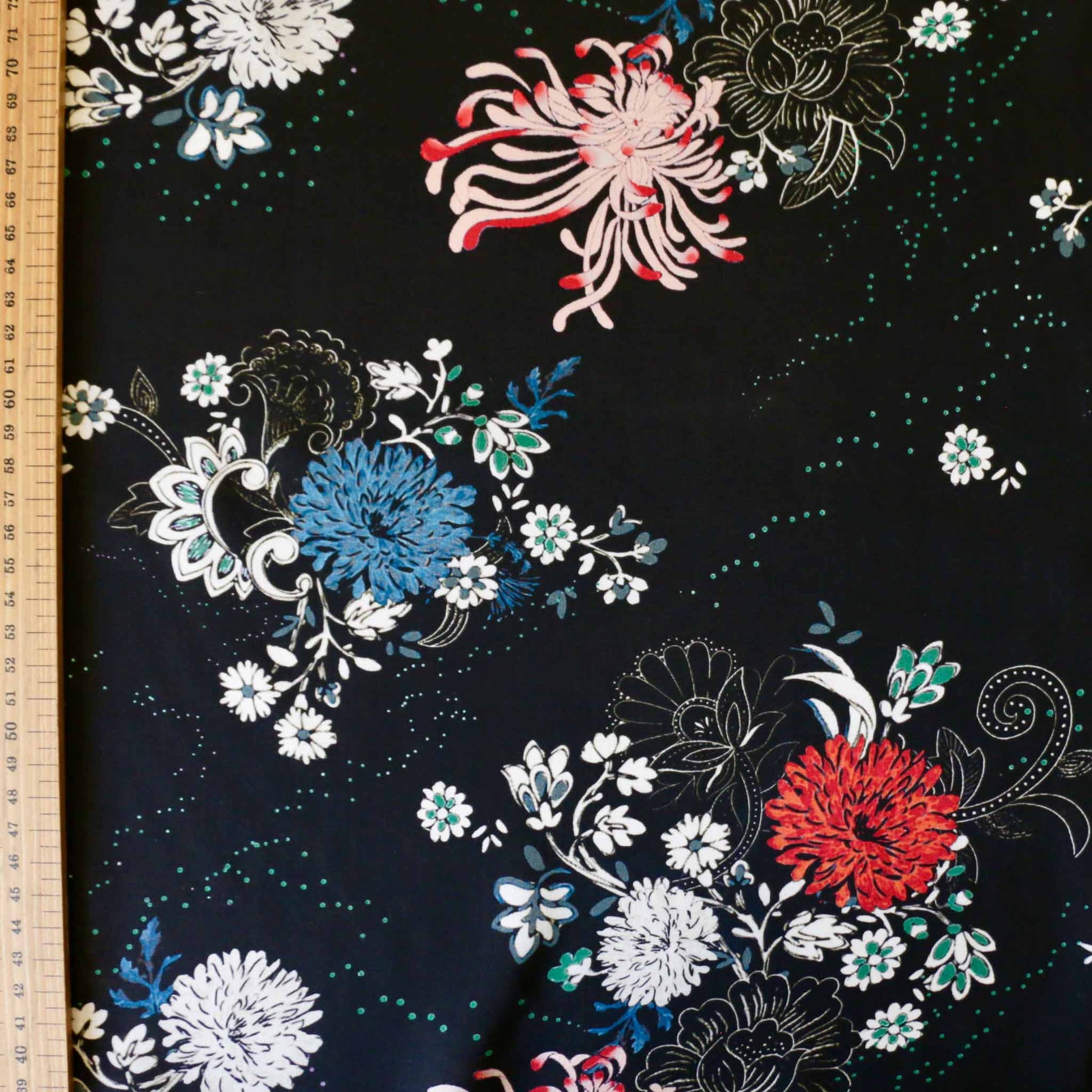 metre black viscose rayon challis dressmaking fabric with red blue and white exotic flowers printed