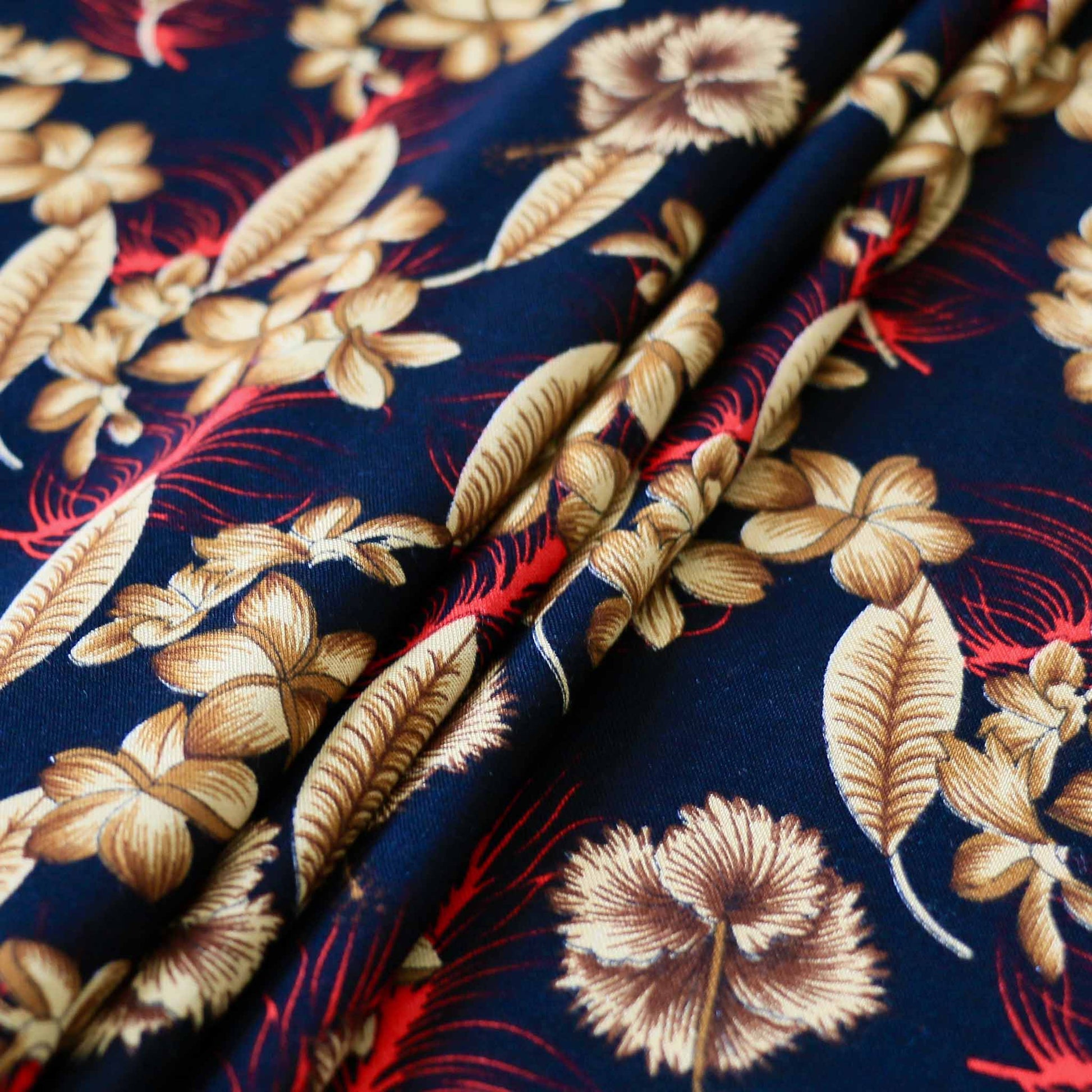 black viscose challis fabric for dressmaking with beige red floral printed flowers