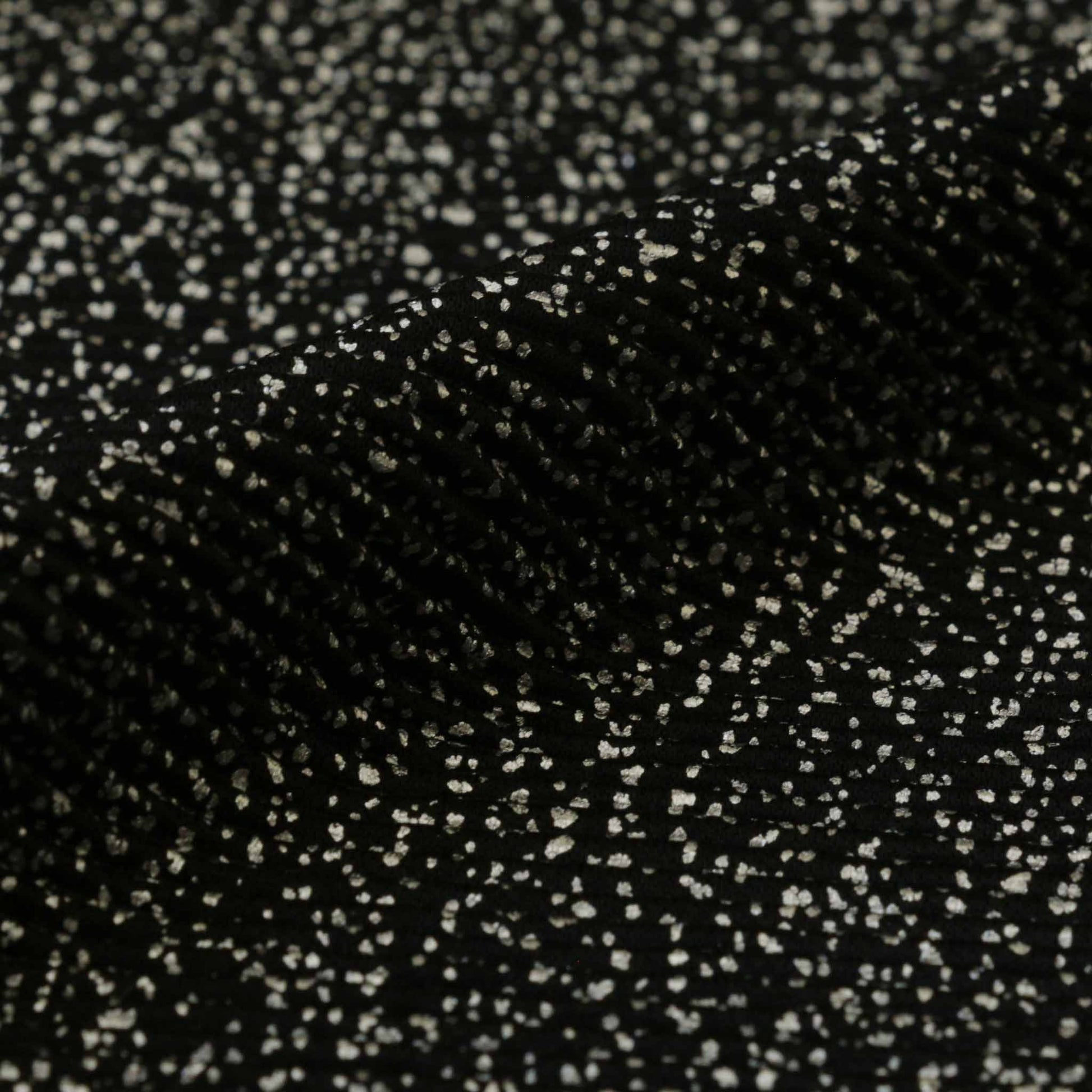 black plisse dressmaking fabric with shimmer silver speckled dot pattern