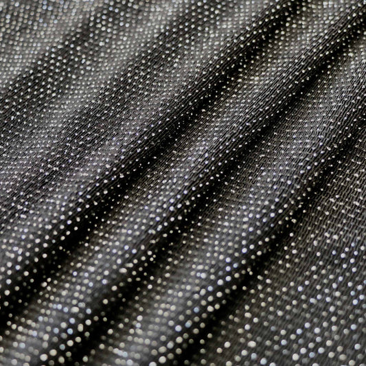 black and silver slinky jersey dressmaking fabric with polka dot pattern