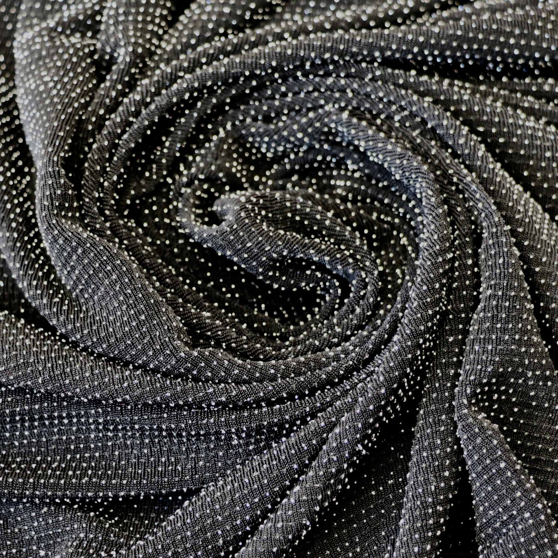 black jersey stretch dressmaking slinky fabric with silver dot pattern