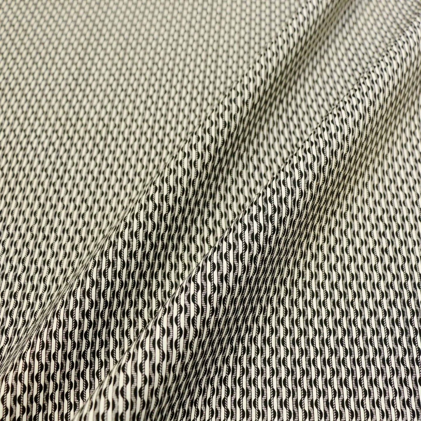 sustainable cotton poplin eco dress fabric with retro stripe and swirl design