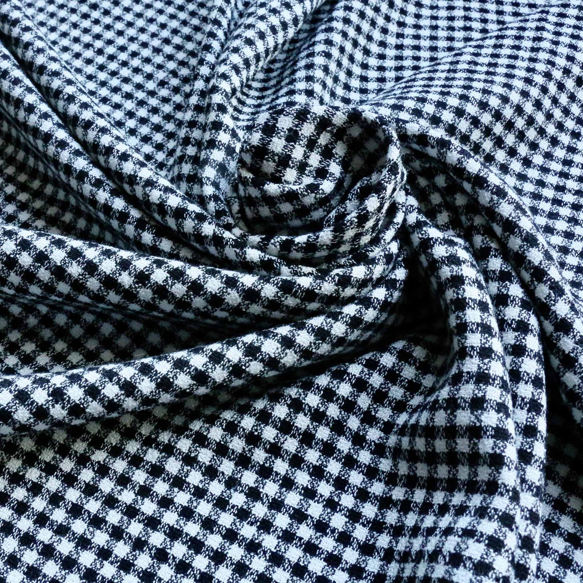 viscose crepe dressmaking fabric in black and white check design 