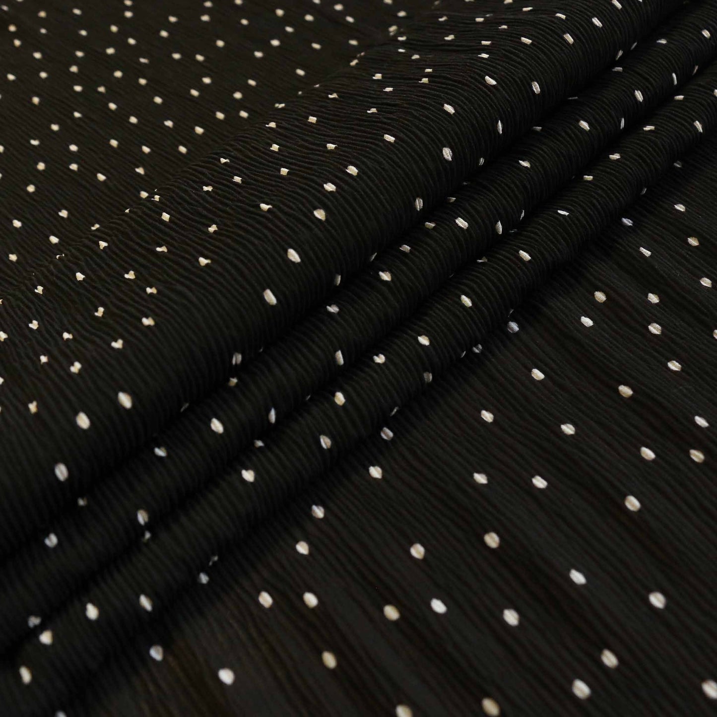 black georgette crinkle fabric with white polka dot print