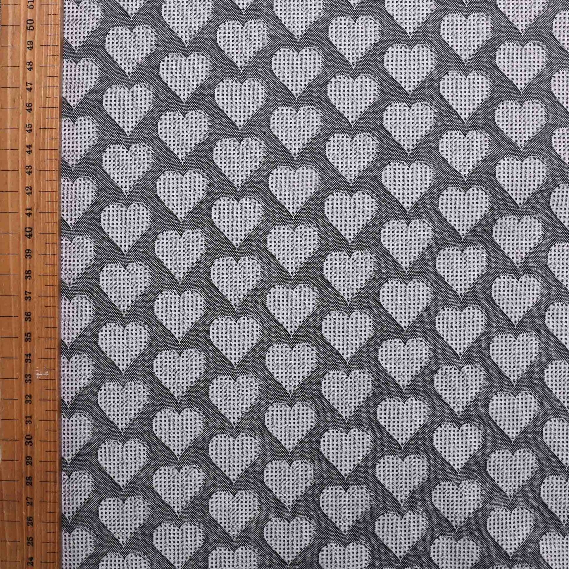 black and white jersey fabric with love heart print