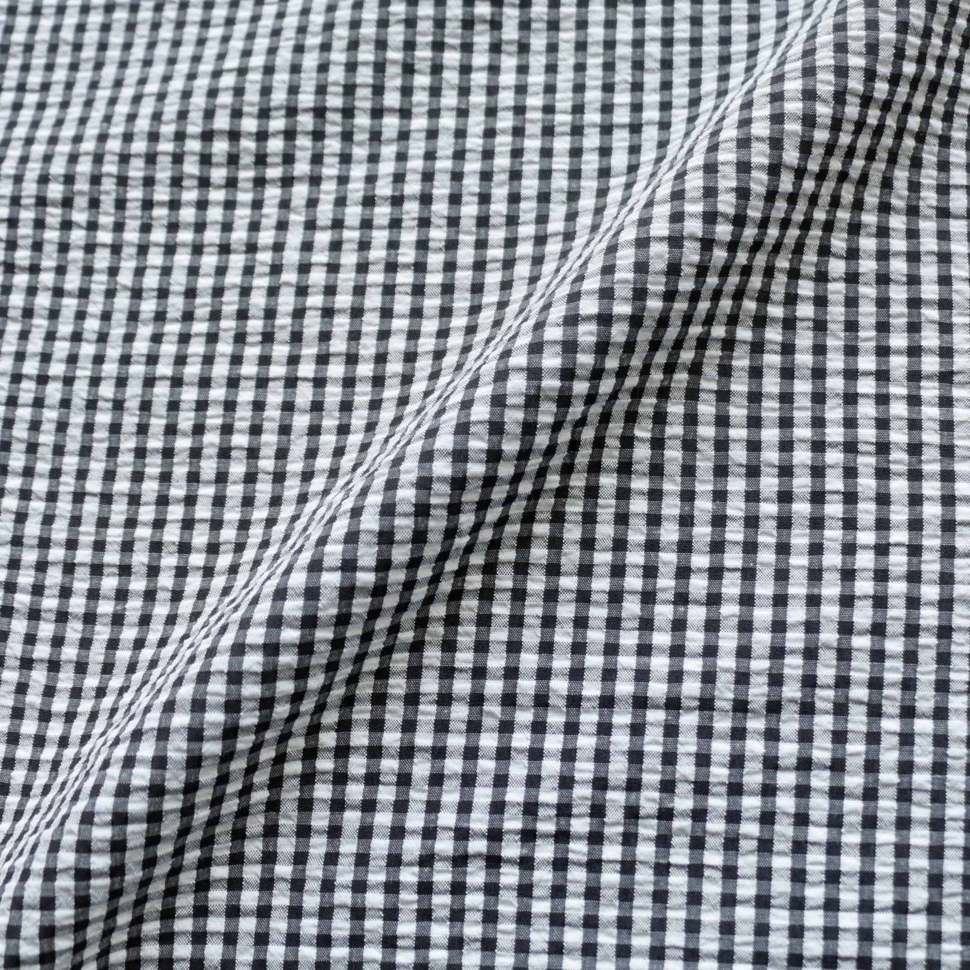 seersucker dressmaking fabric in black and white gingham style 