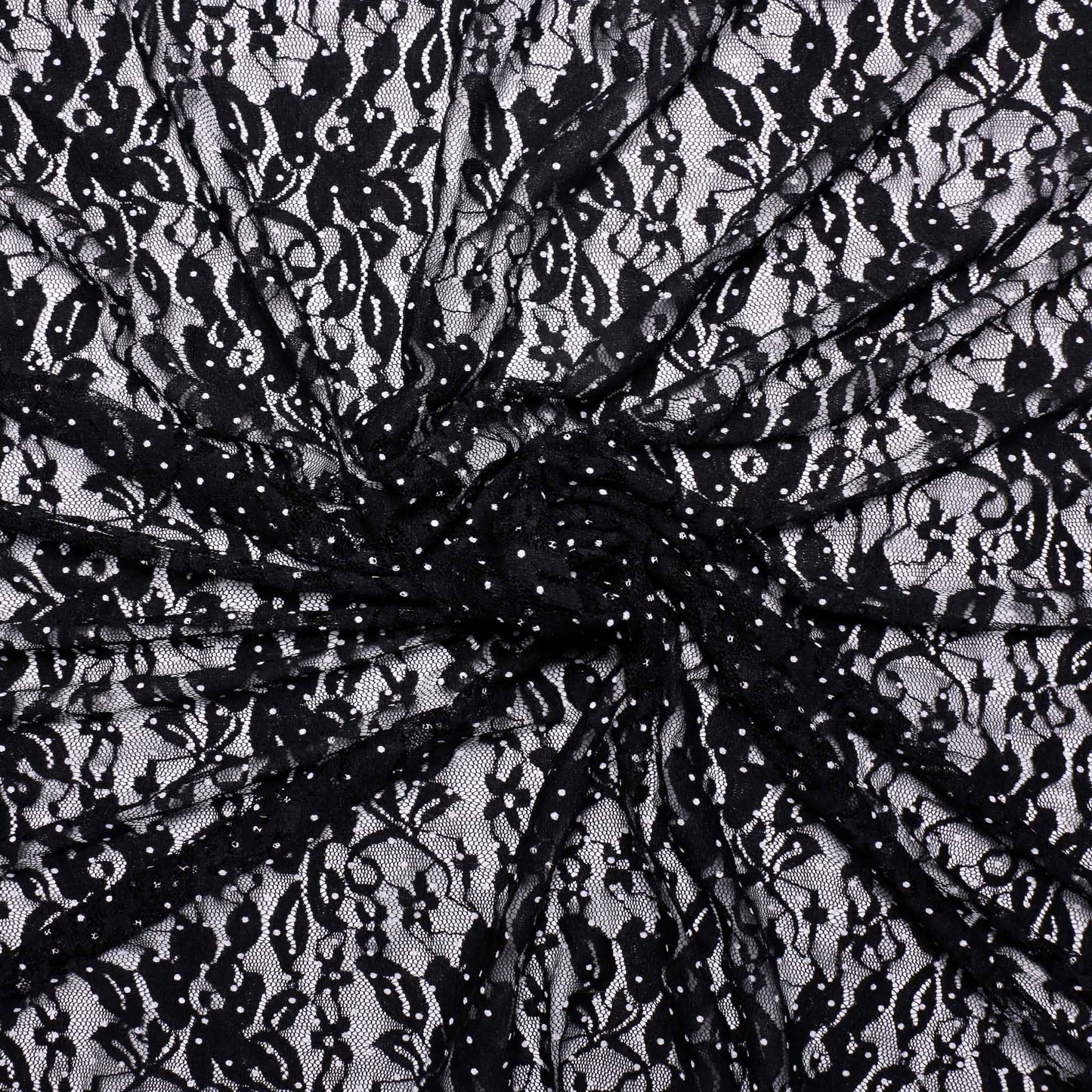 floral black dressmaking lace fabric with white polka dot design