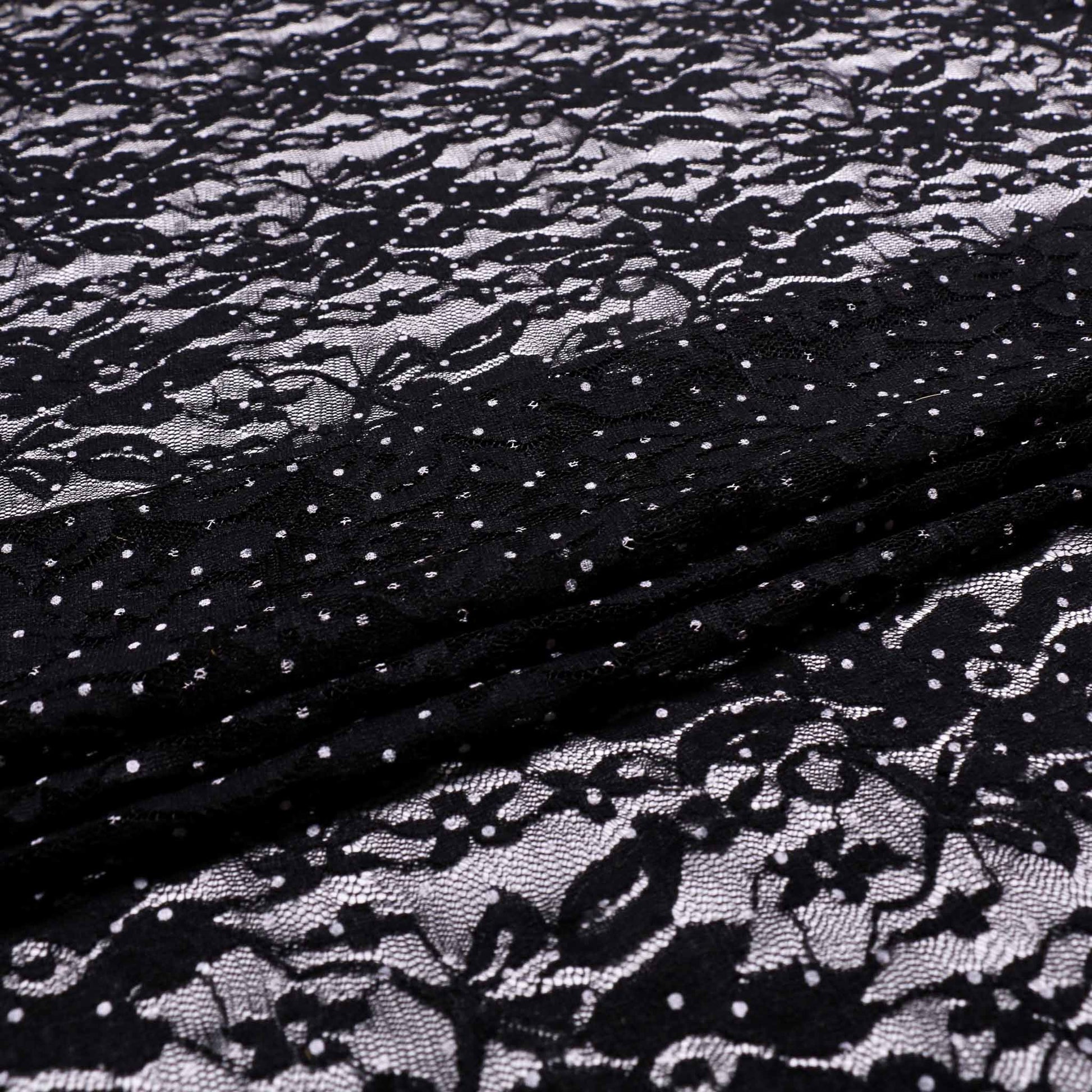 white polka dots on floral black lace stretchy dressmaking fabric