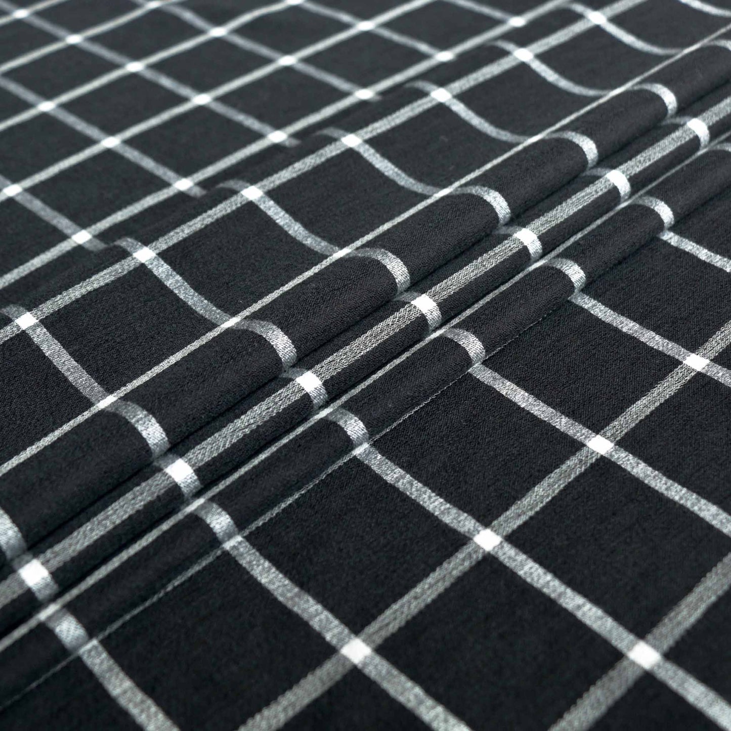 check pattern in black and white on viscose rayon dressmaking fabric