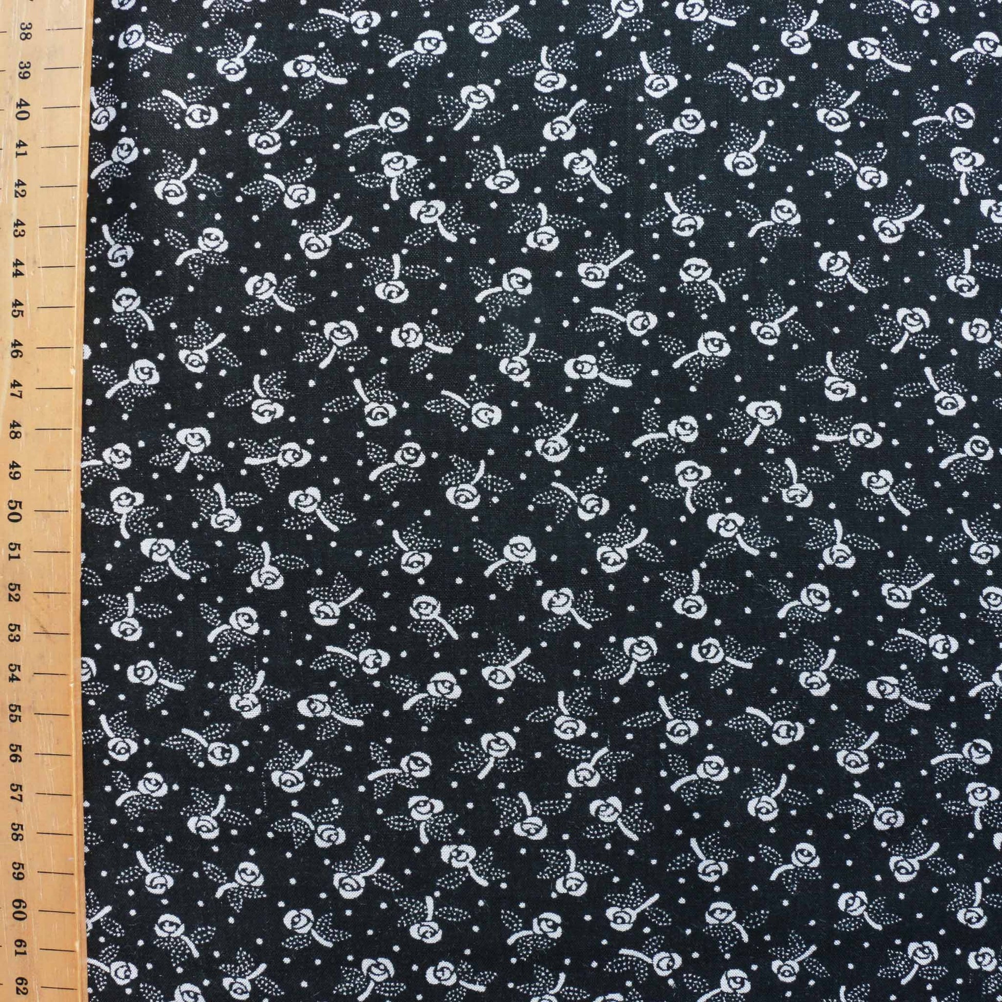 metre rose printed black viscose voile dressmaking fabric with white detail
