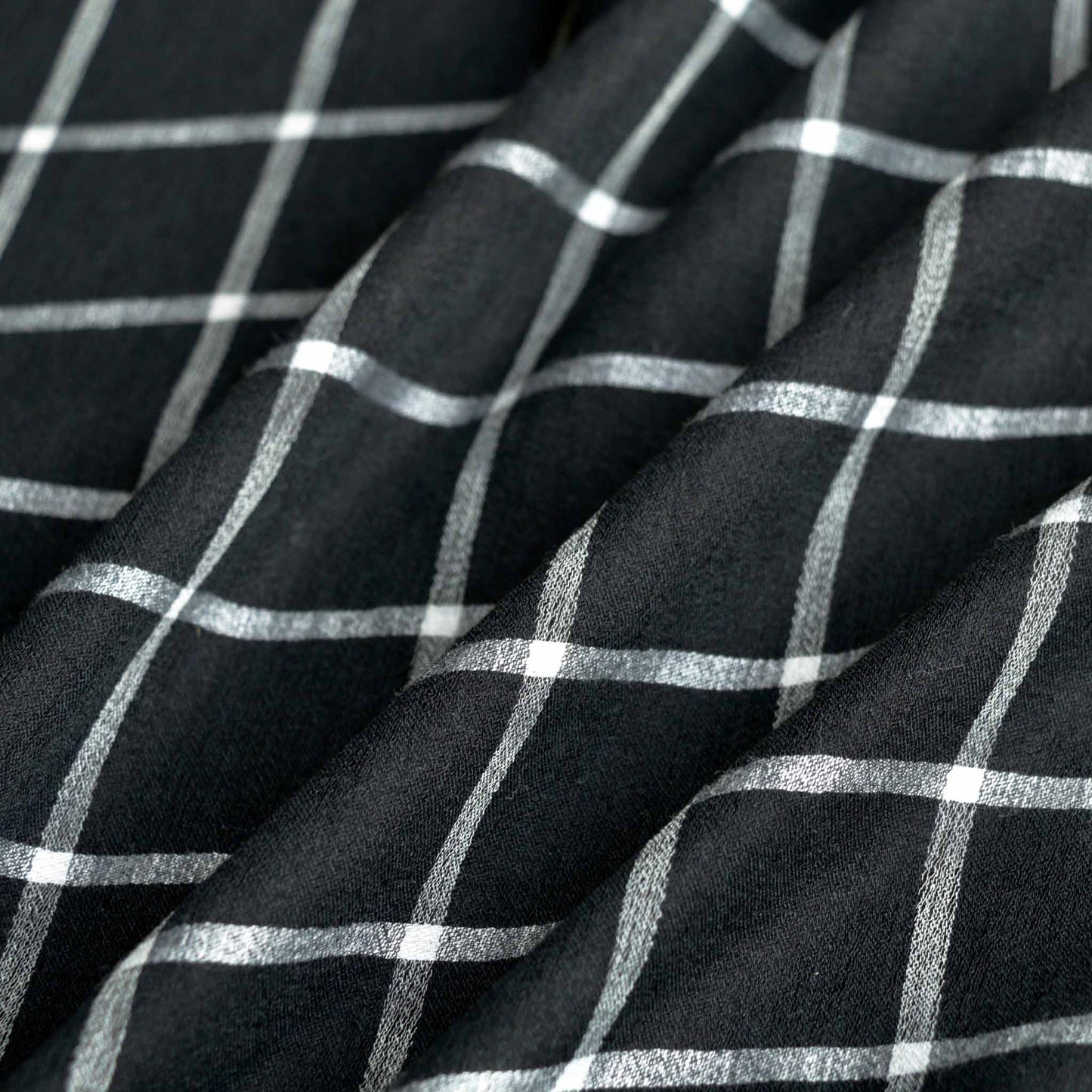 viscose voile dressmaking fabric in black with white checked design