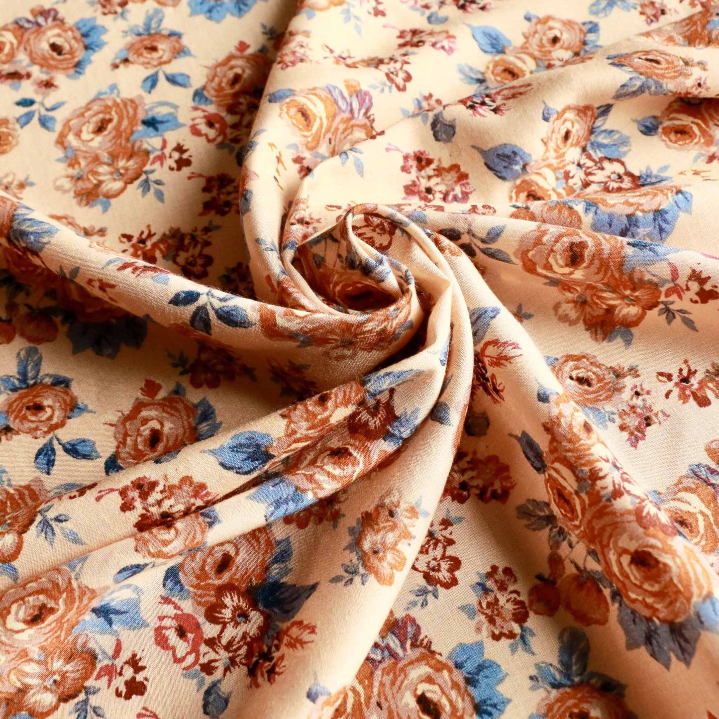 blue beige and cream viscose challis dressmaking fabric with classical floral print