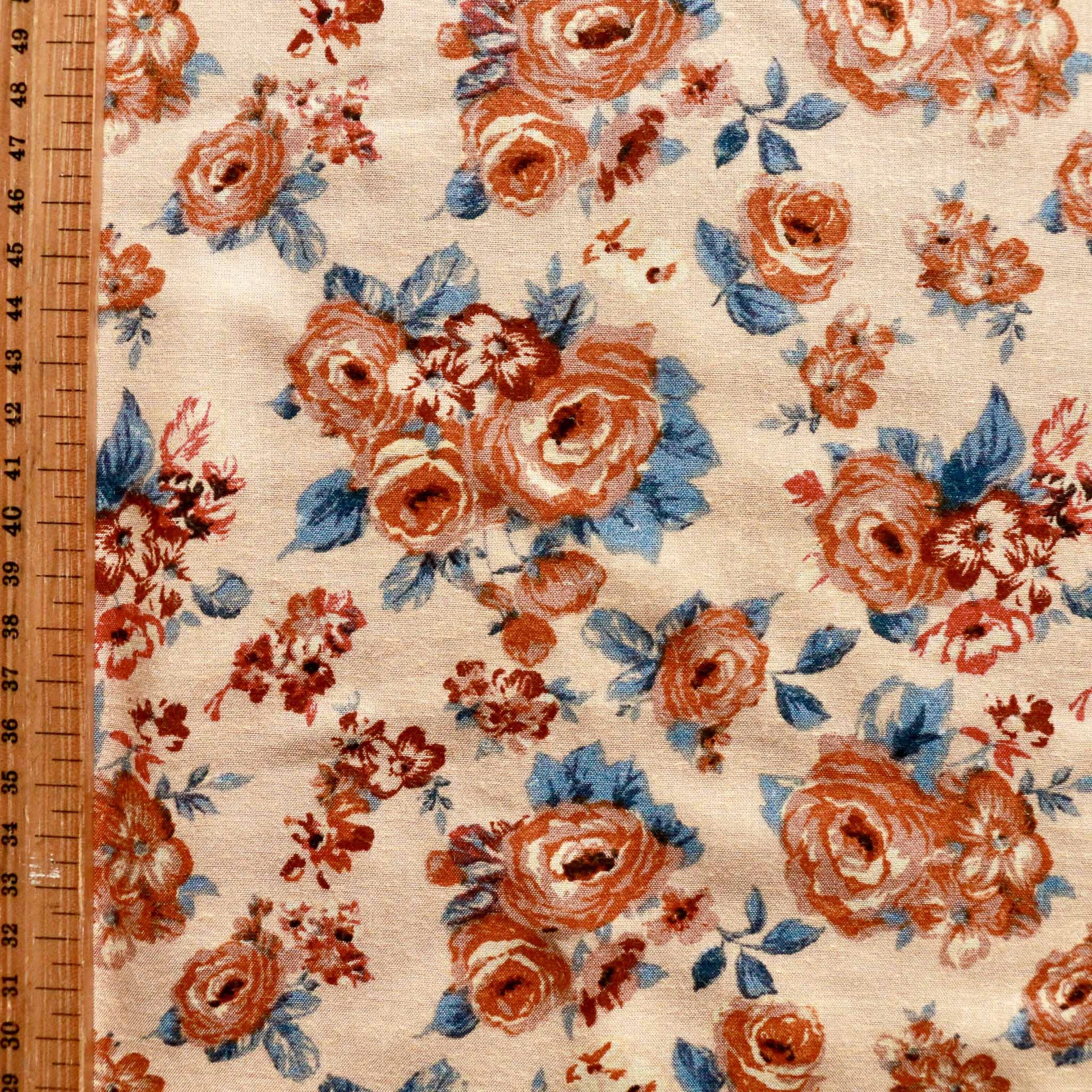 metre beige light brown viscose challis dressmaking fabric with classic floral print in orange and blue