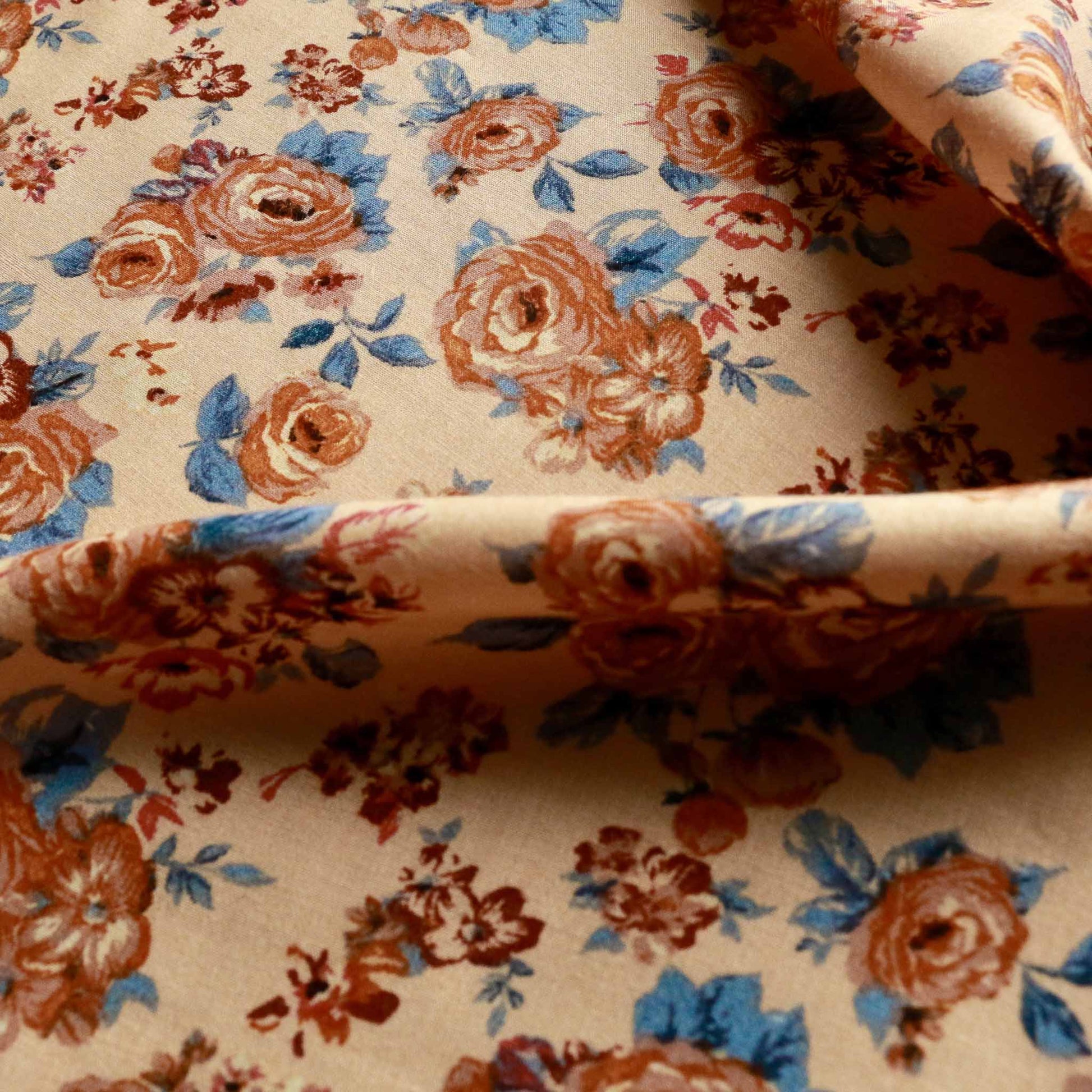 natural pastel coloured viscose challis dressmaking rayon fabric with classical floral print in blue and orange