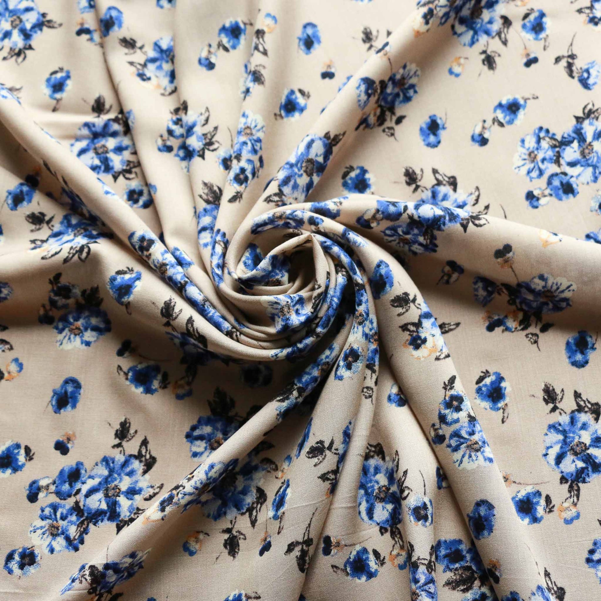 blue and beige viscose challis dressmaking rayon fabric with delicate flower print