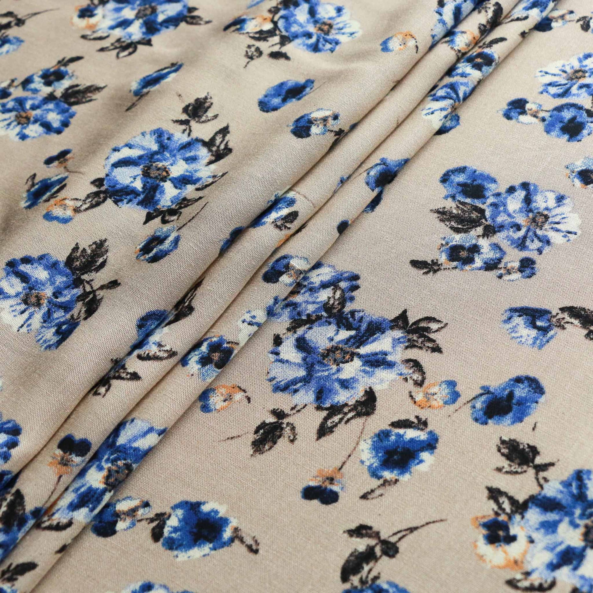light beige viscose challis dressmaking rayon fabric with classic blue floral print design