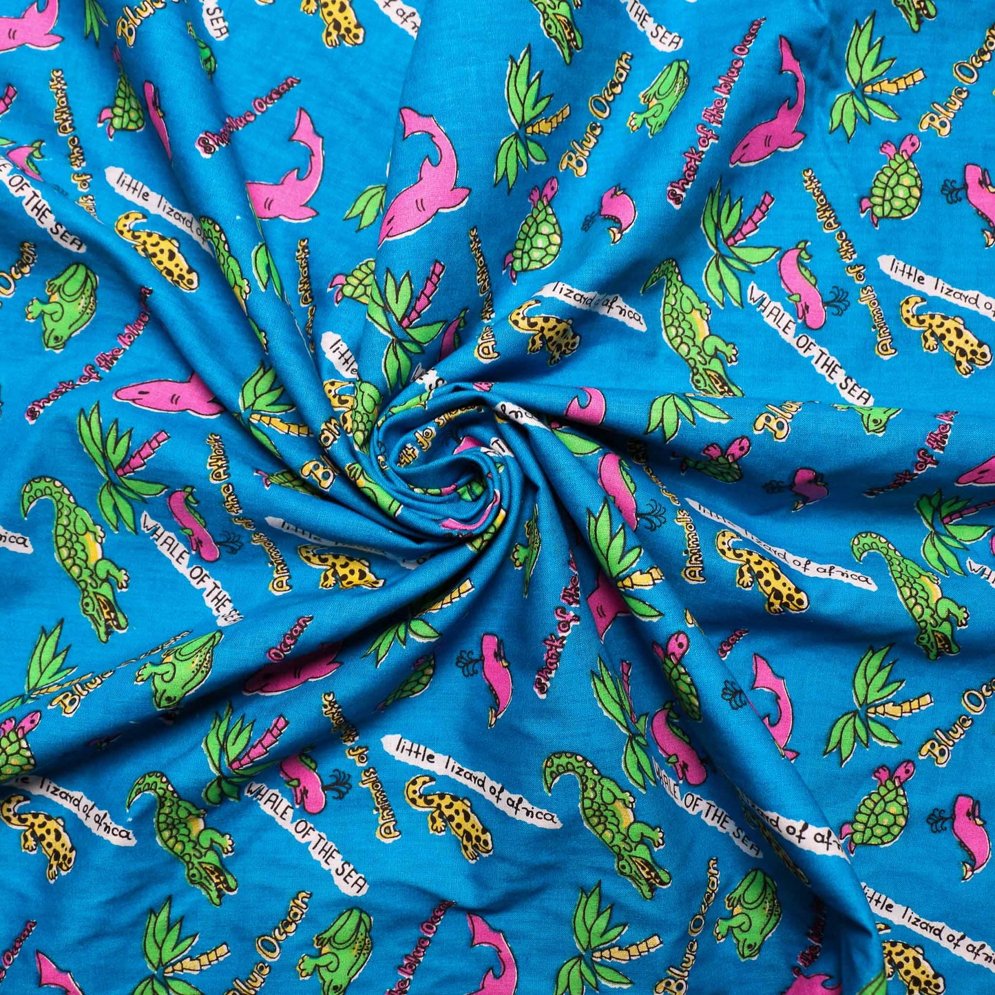 blue sustainable retro cotton dressmaking poplin fabric with pink green sea animals print