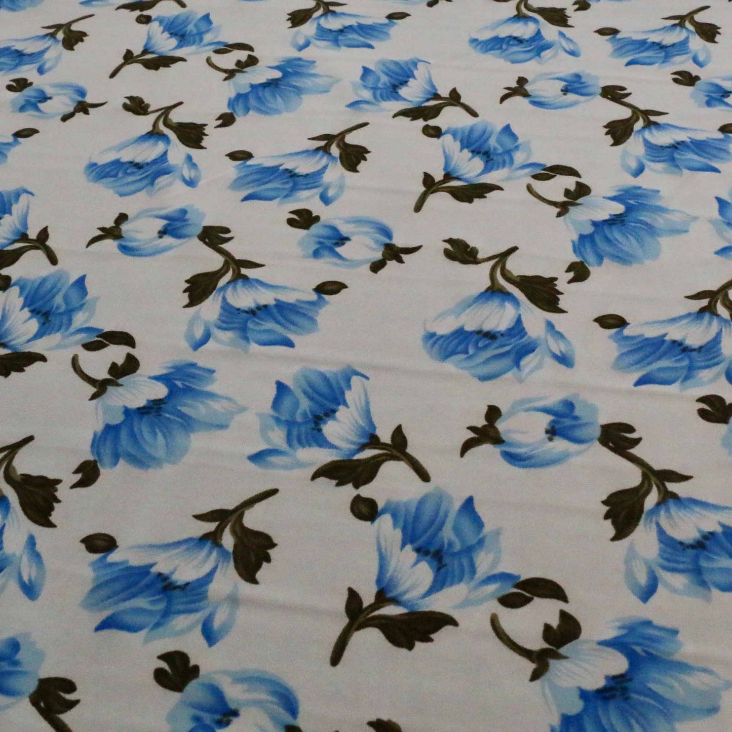blue and white chiffon polyester synthetic stretchy dressmaking fabric with floral print design